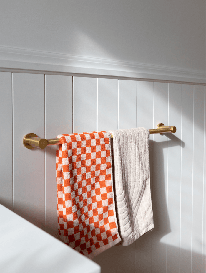 Dulux's Wash&Wear matte in Mt Aspiring Quarter provides a neutral base colour for bold statements to be made with accessories.