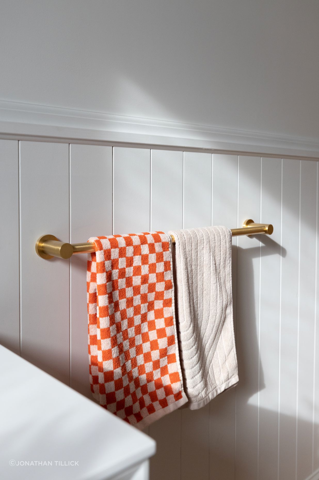 Dulux's Wash&Wear matte in Mt Aspiring Quarter provides a neutral base colour for bold statements to be made with accessories.