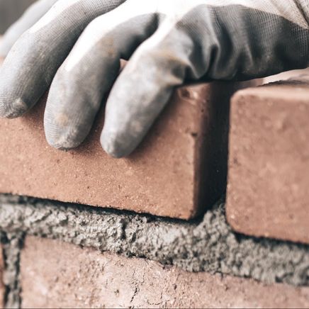 The bricklayers building the foundations for an ambitious affordable housing project