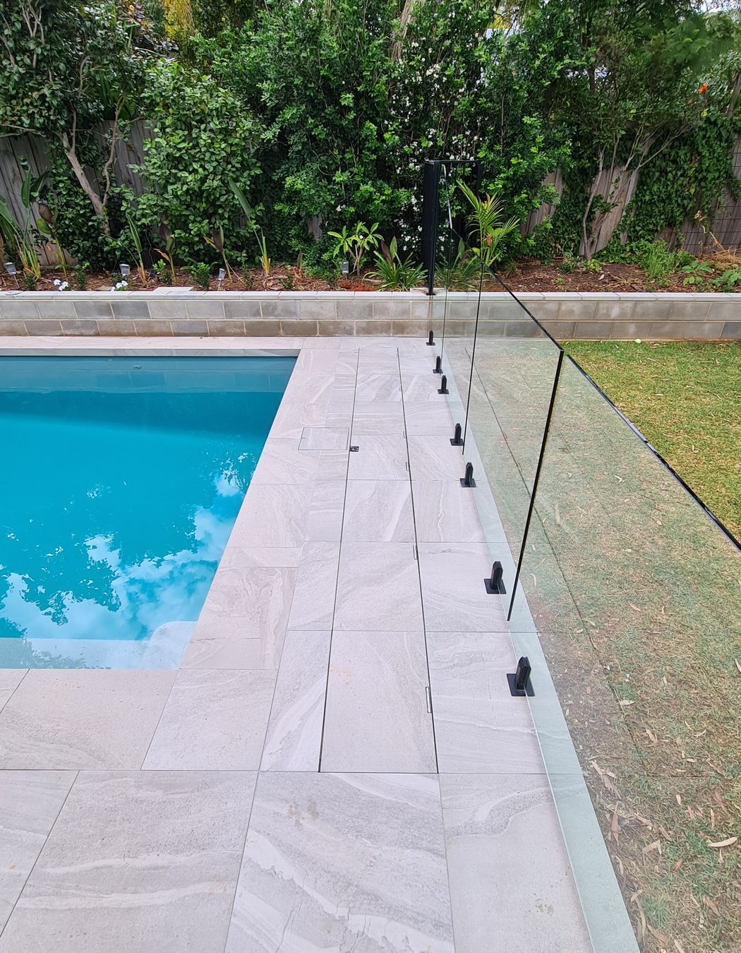 Tiles can be seamlessly installed on the cover lid, so that it's virtually invisible.