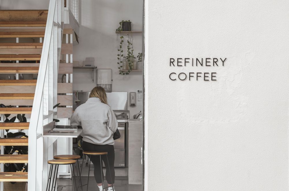 Signage can be used as a distinct and elegant way to signpost a business, as seen here at Refinery Coffee.
