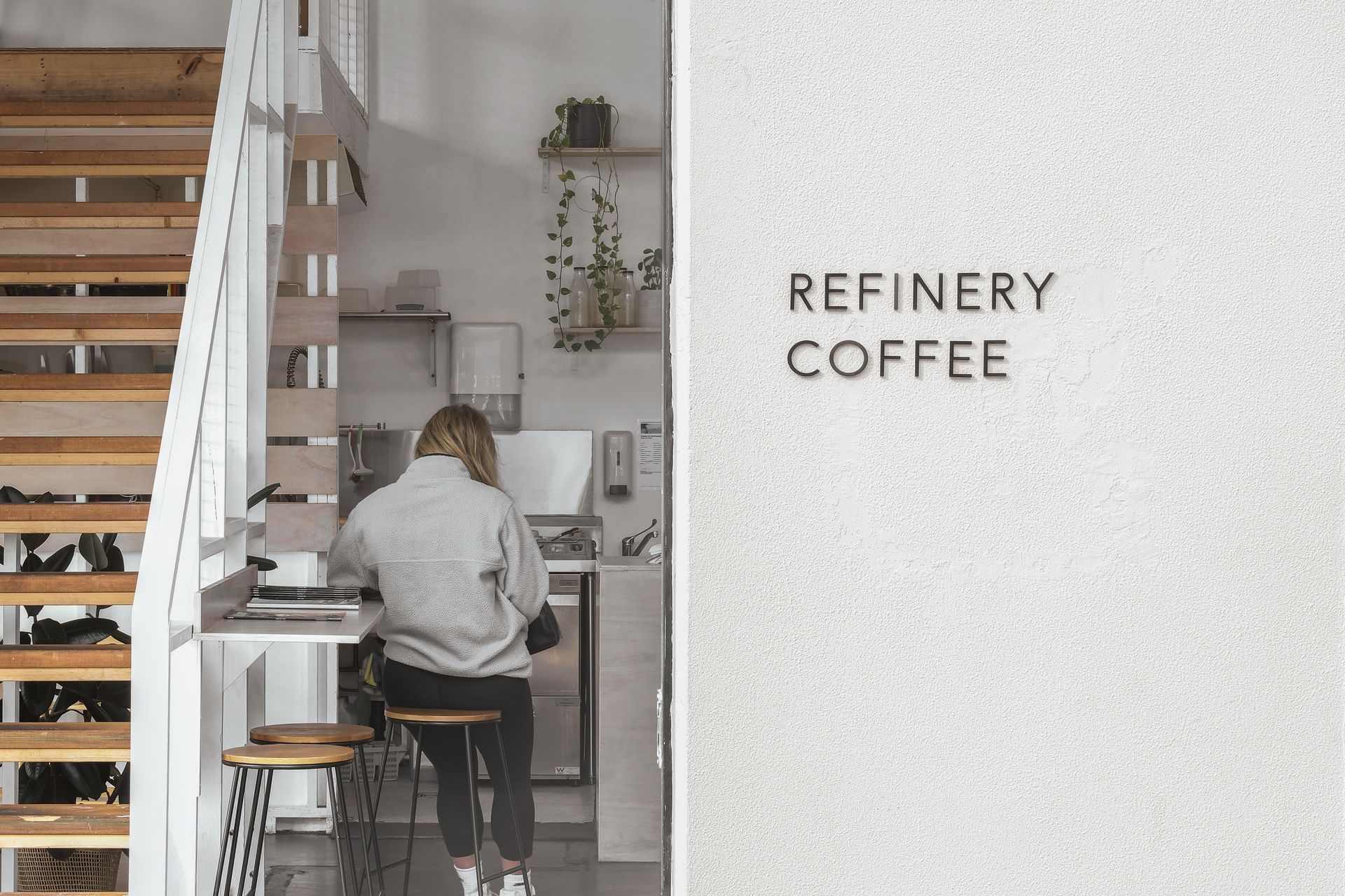 Signage can be used as a distinct and elegant way to signpost a business, as seen here at Refinery Coffee.