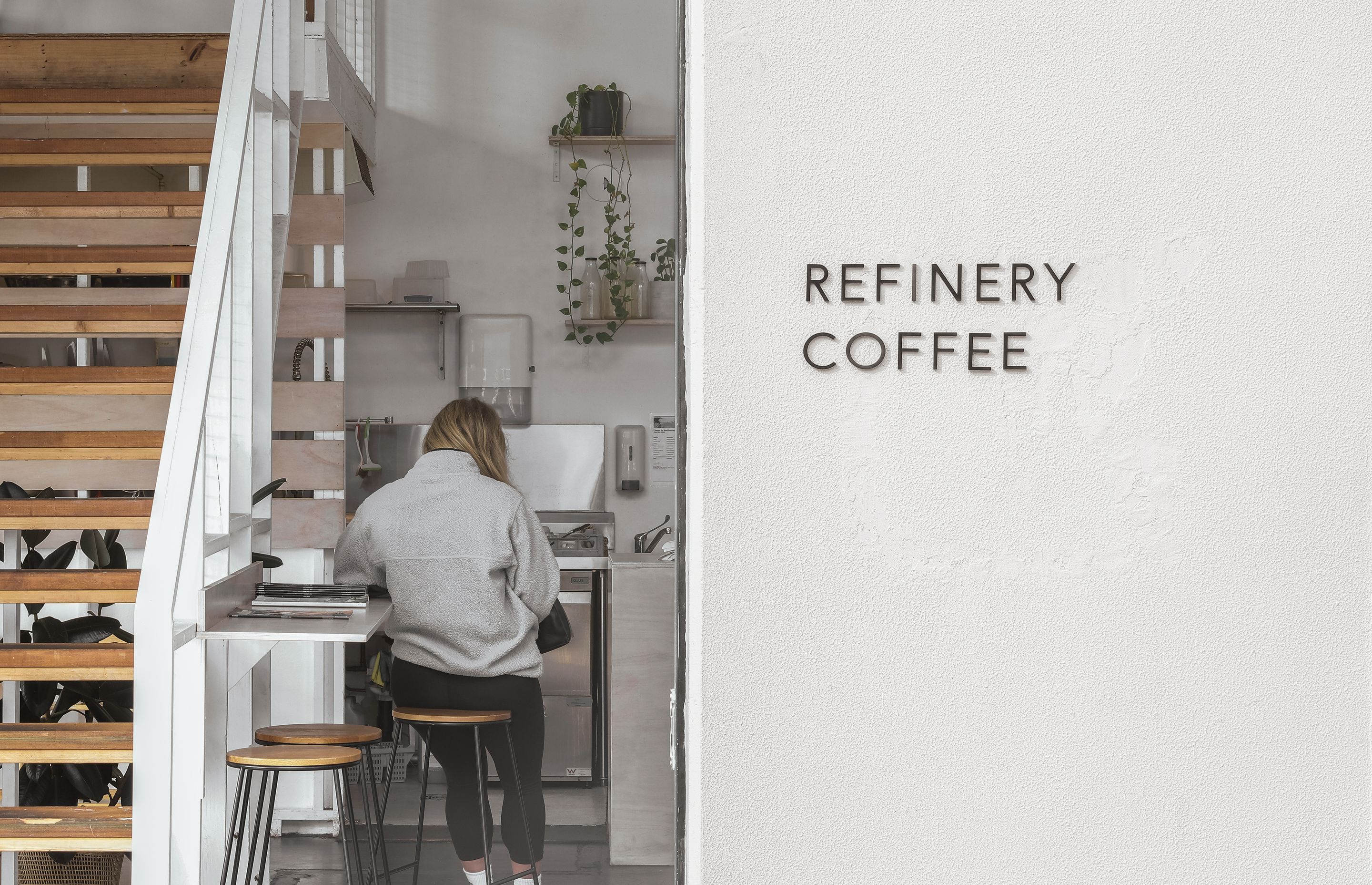 Signage can be used as a distinct and elegant way to signpost a business, as seen here at Refinery Coffee.