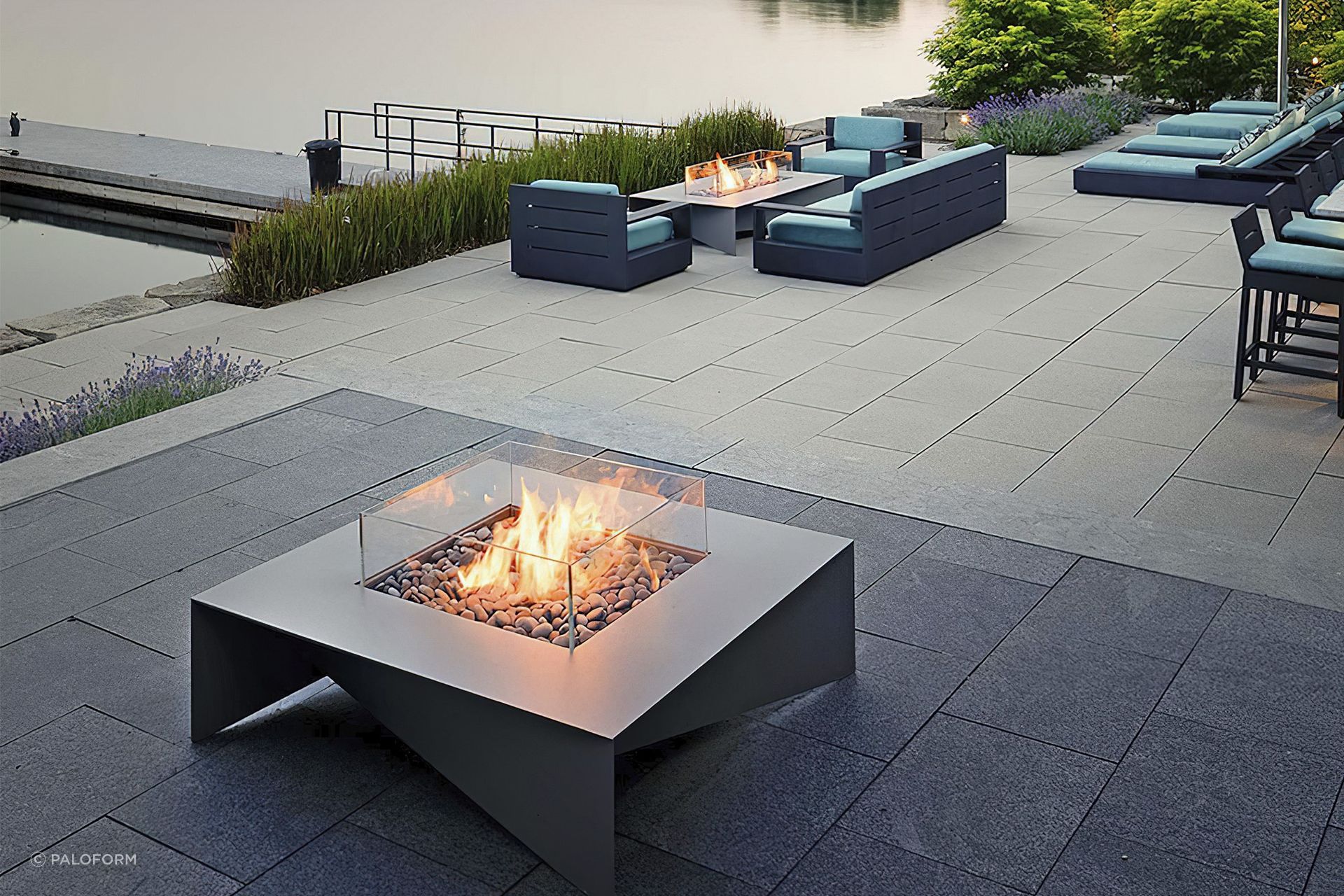 The delicate aluminium planes of the Fold Fire Table touch the ground at each corner in a way that exudes quality