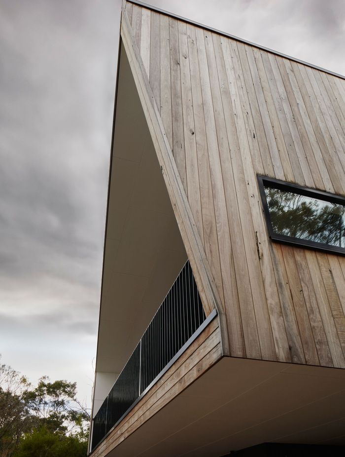 Recycled red ironbark cladding has been left to age naturally and blend with the surrounding environment.