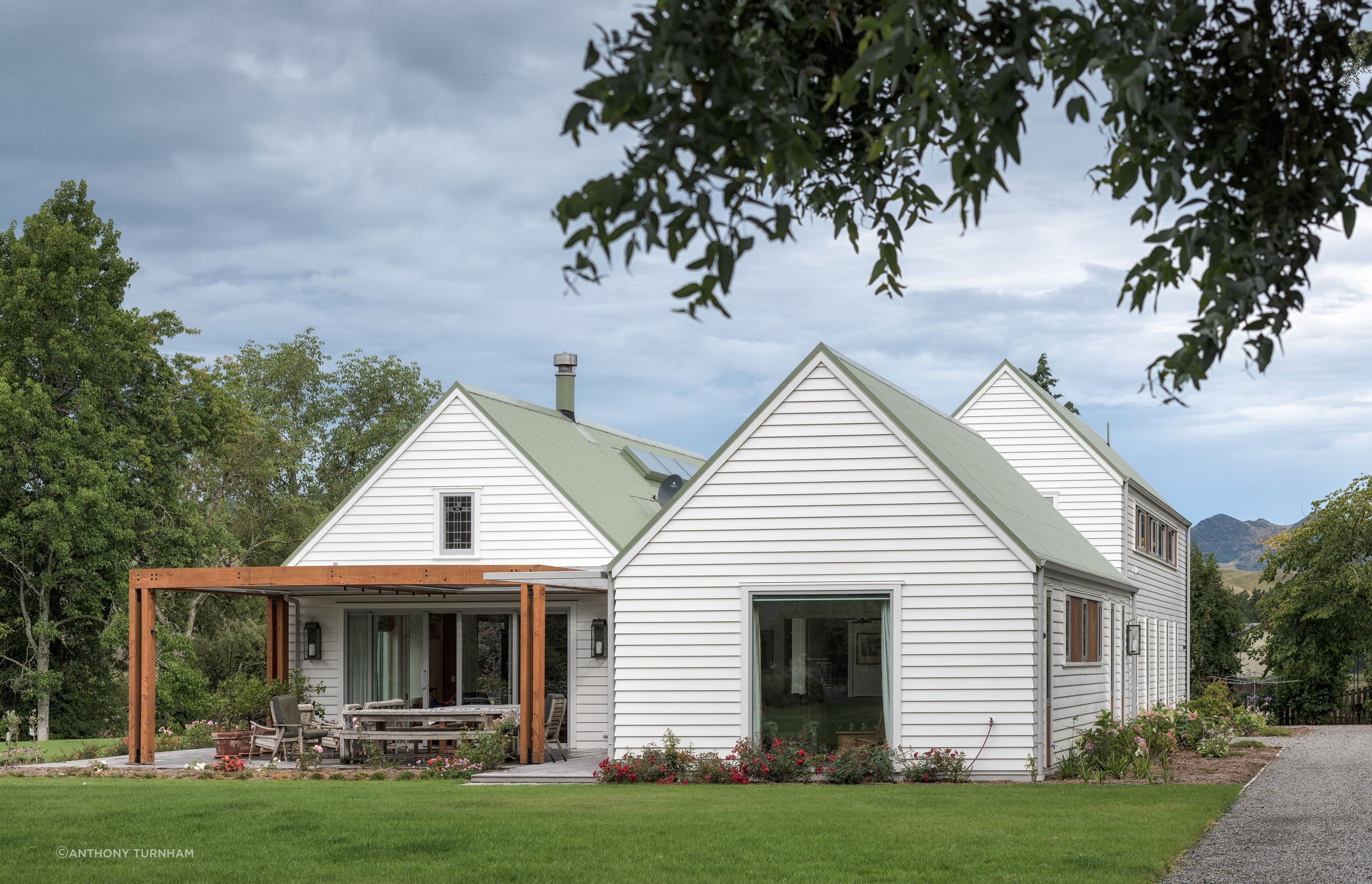 The three main forms of the new homestead. The site is quite remote so builders and contractors would stay during the week in shearers’ quarters during the build. The small leadlight window was saved from the earthquake-damaged house and reused here.