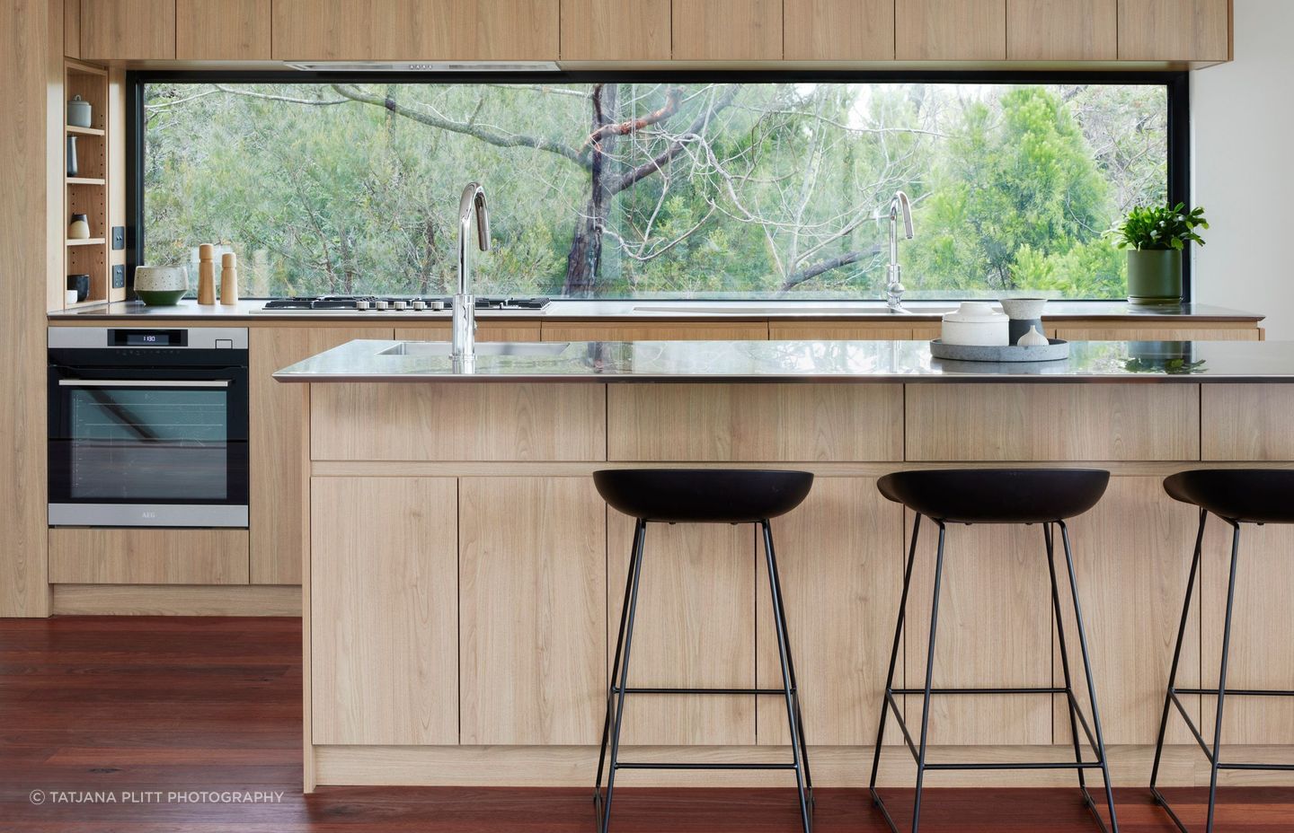A window has been chosen as the kitchen splashback to maximise natural light and the beautiful view.