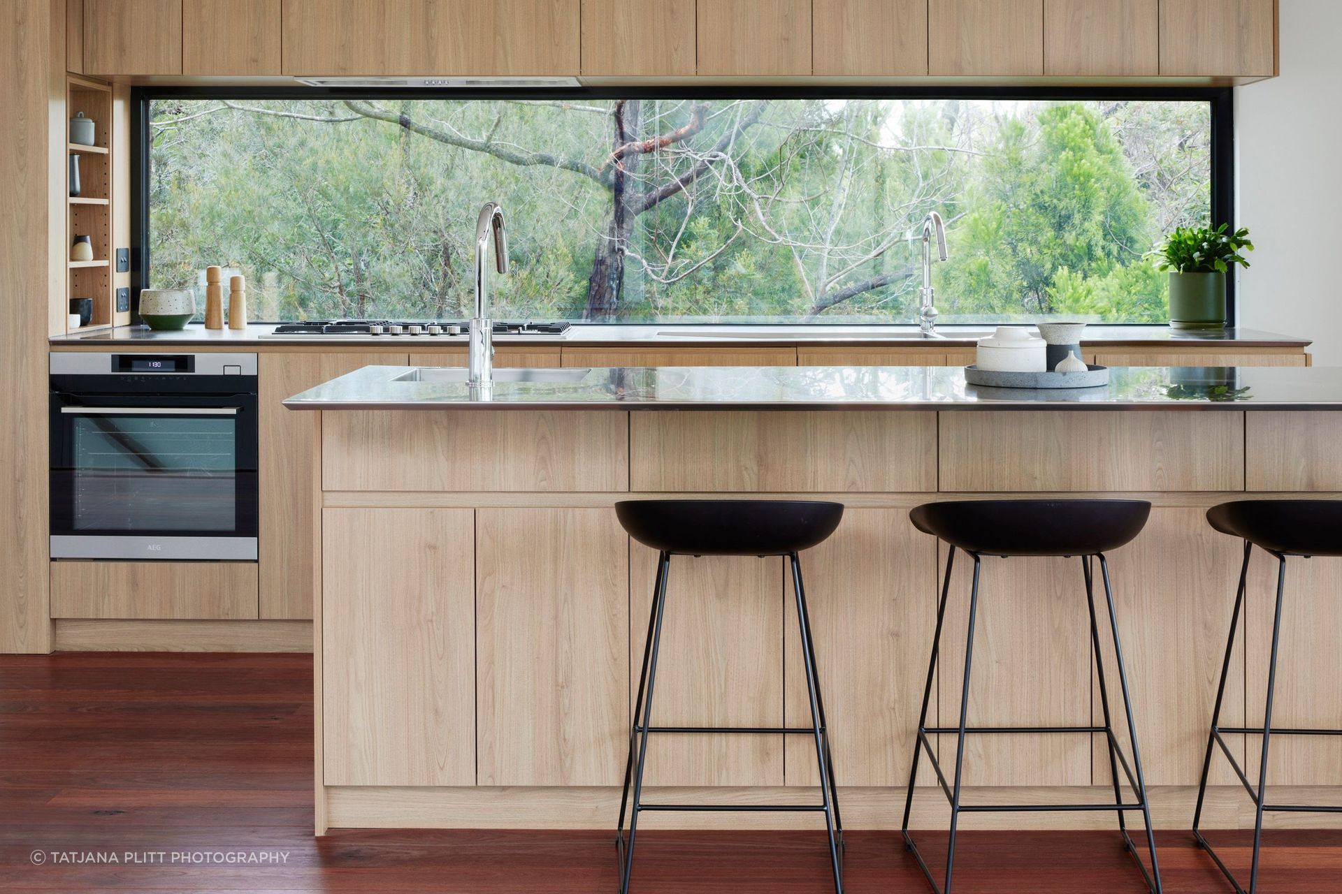 A window has been chosen as the kitchen splashback to maximise natural light and the beautiful view.