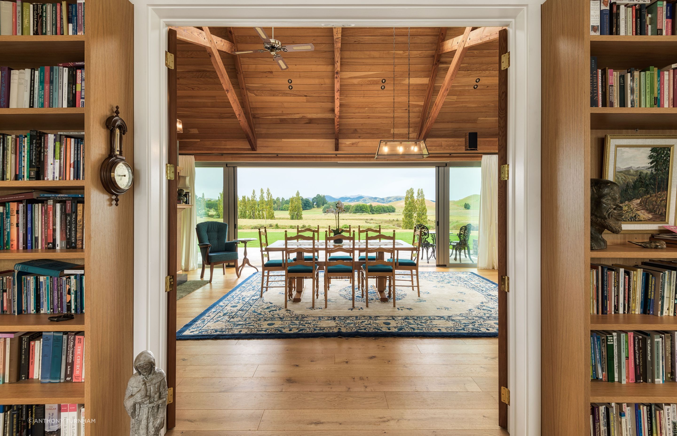 The view across the dining table. The flooring is by Forté Flooring and the ceiling is macrocarpa.