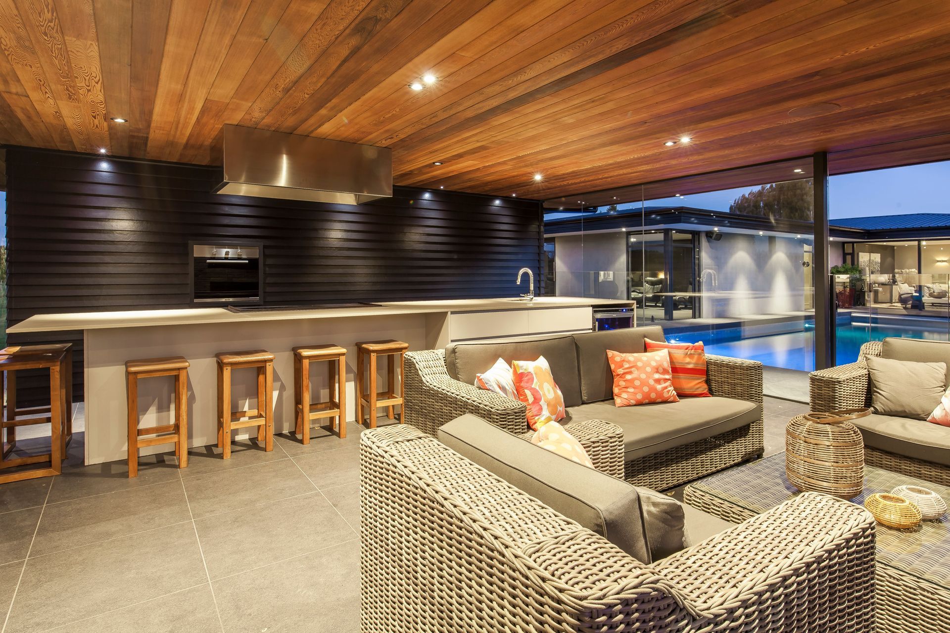 Outdoor furniture and pavers mean family and guests can enter the space directly from the pool after swimming.