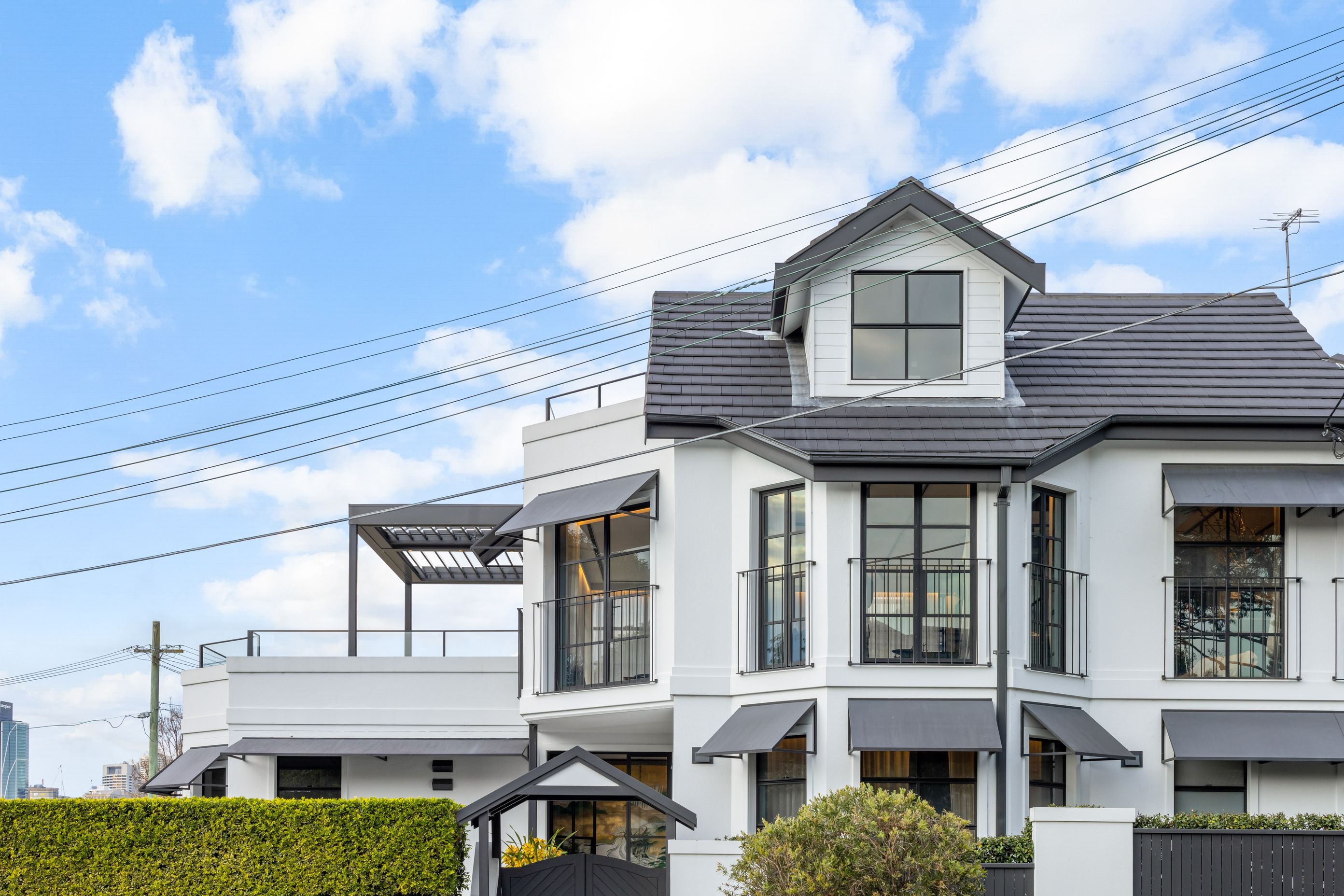 The extensive changes to the windows and doors in the home add character and street presence.