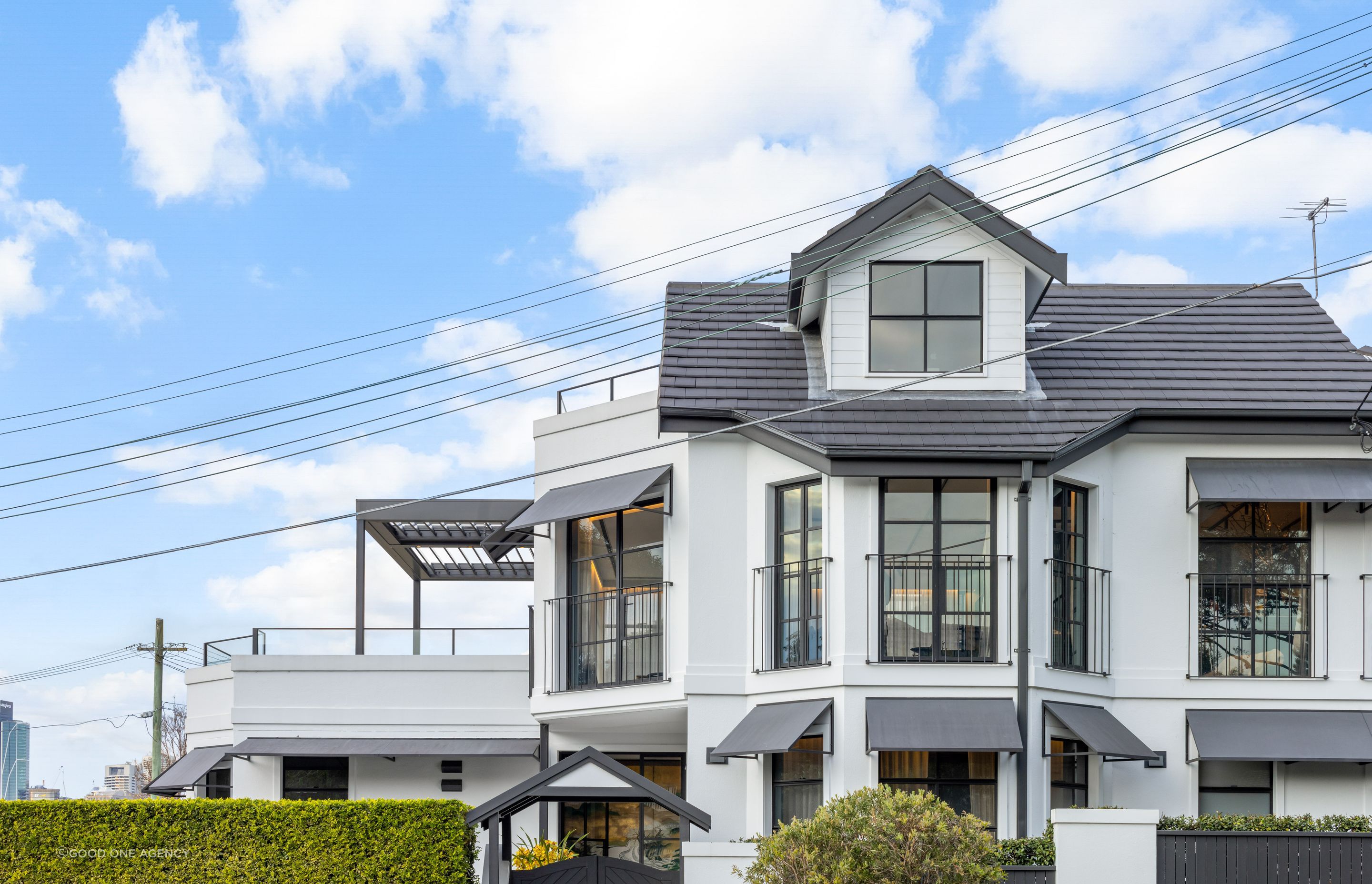 The extensive changes to the windows and doors in the home add character and street presence.