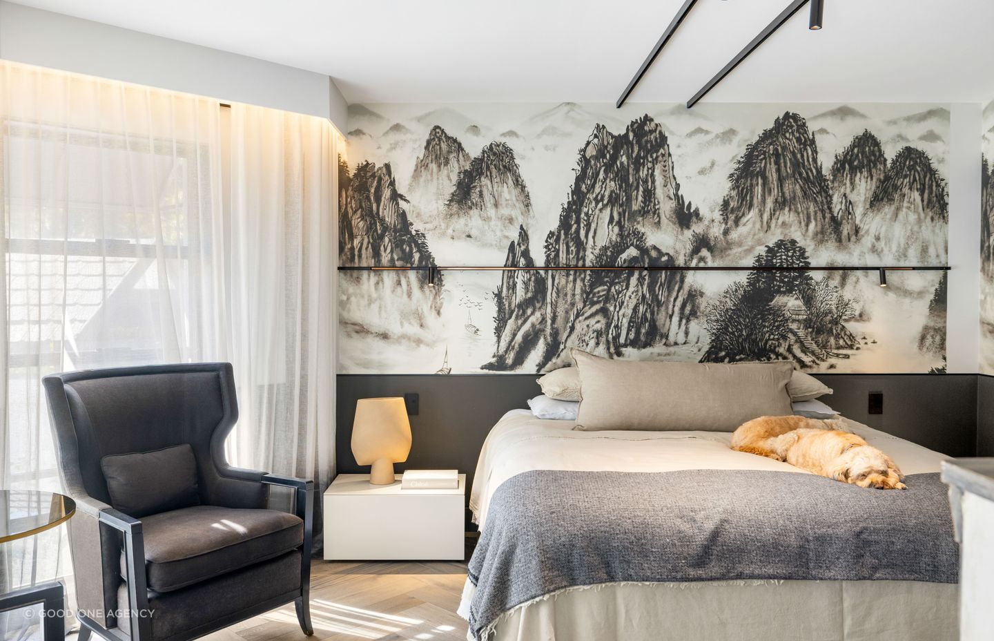 In the master suite, feature wallpaper adds texture and interest.