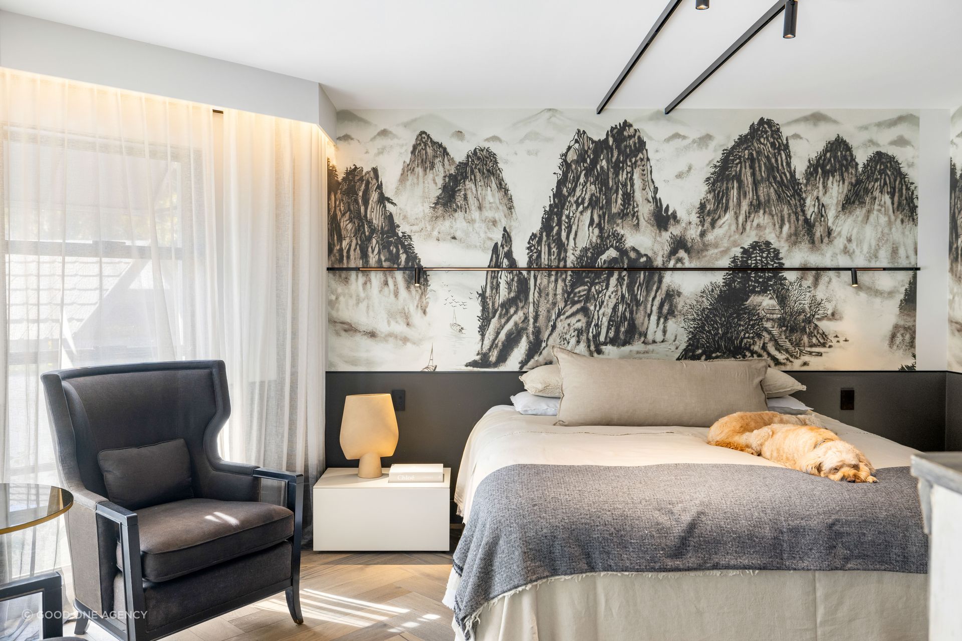 In the master suite, feature wallpaper adds texture and interest.