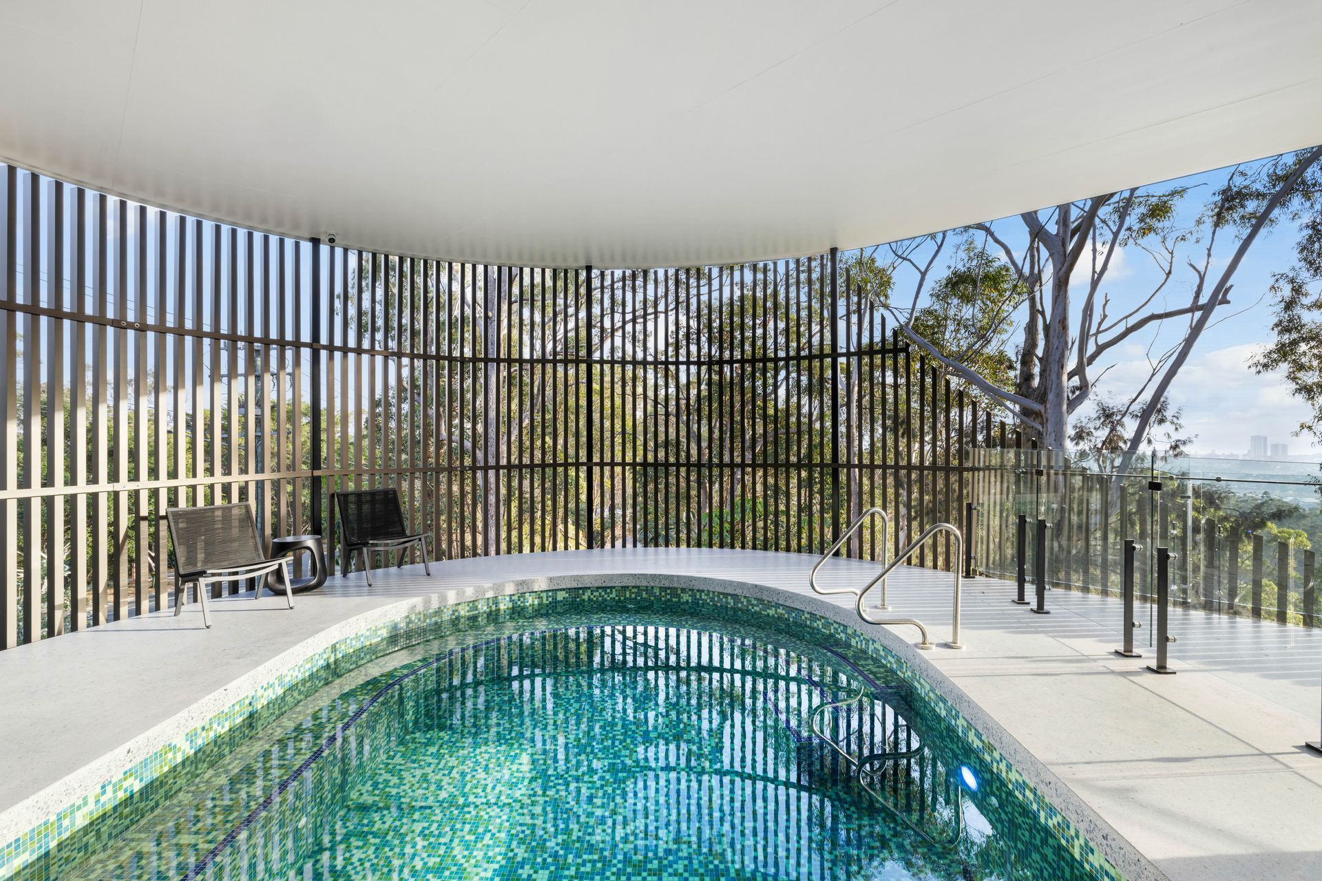 The Spanish glass mosaic tiles glitter like a jewel, drawing in the colours of the sky and sea.