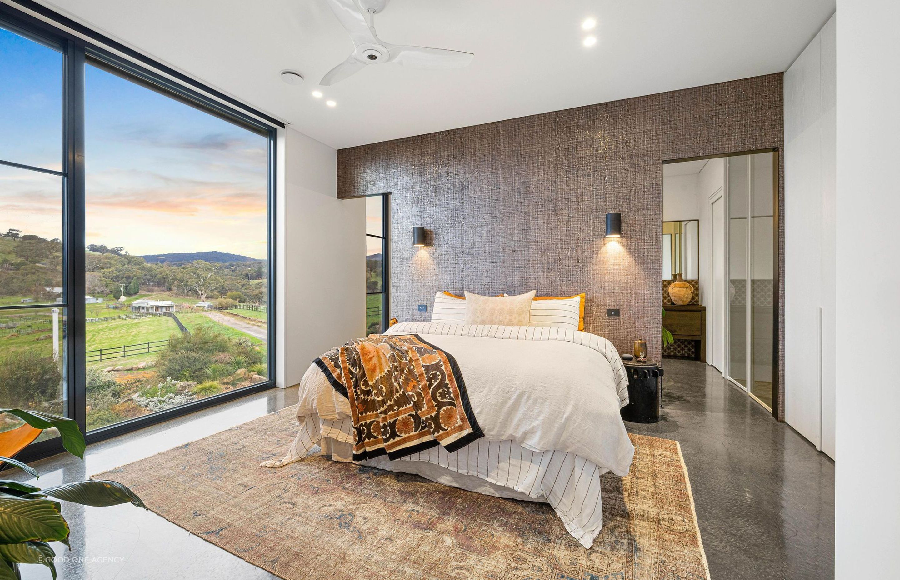 The guest room in the guest wing at Euroa House is layered and cosy