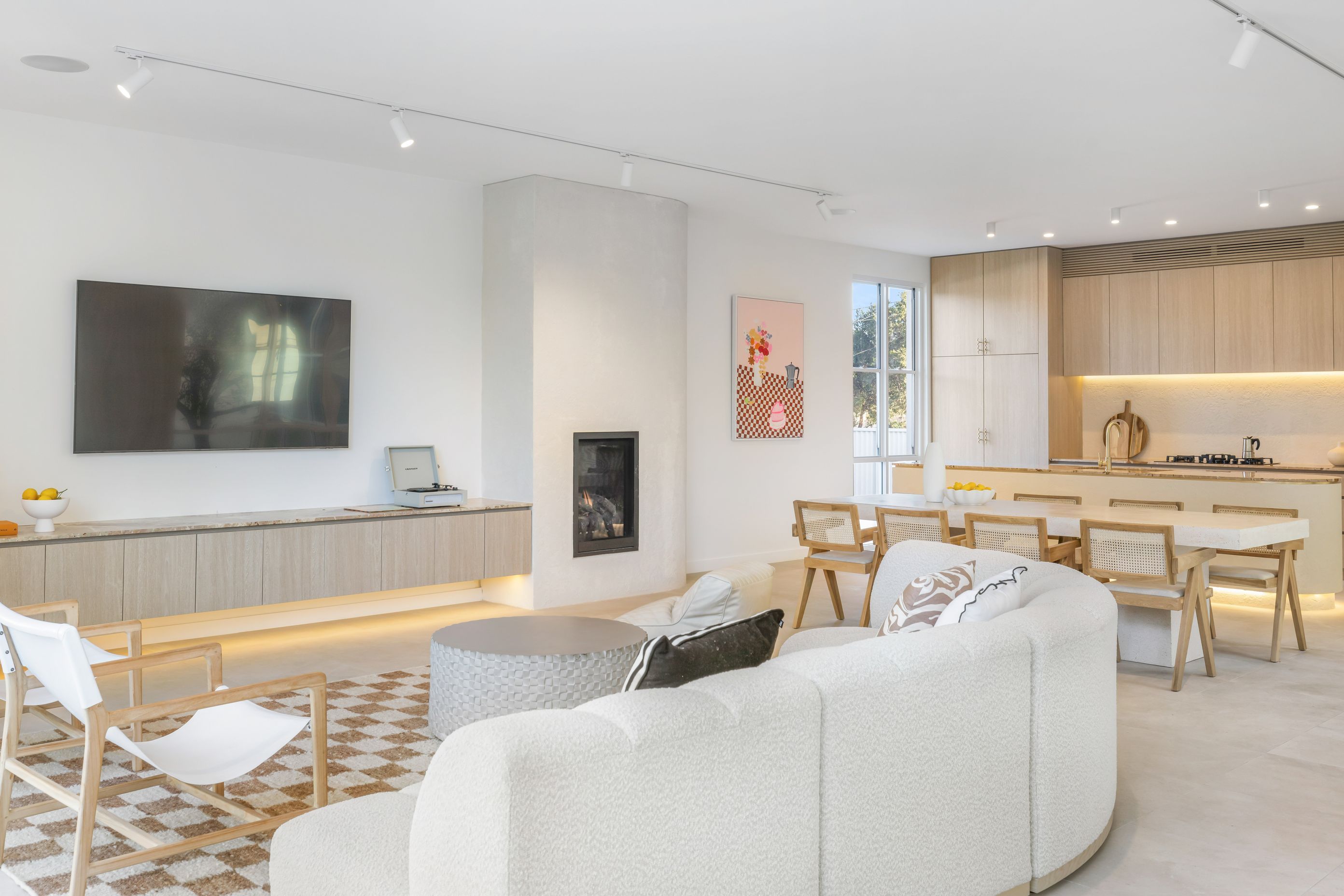 The living areas are found at the rear of the home and are open-plan.