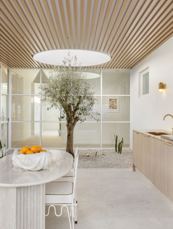 The olive tree can be seen from the front entrance and the hallway.