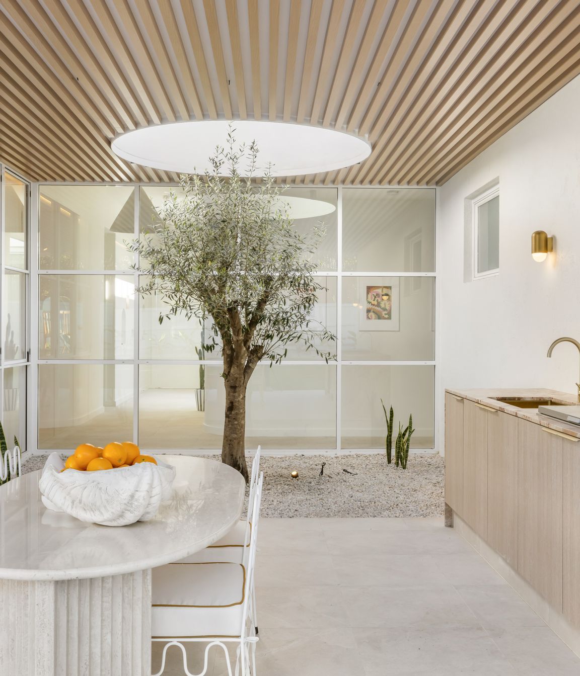 The olive tree can be seen from the front entrance and the hallway.