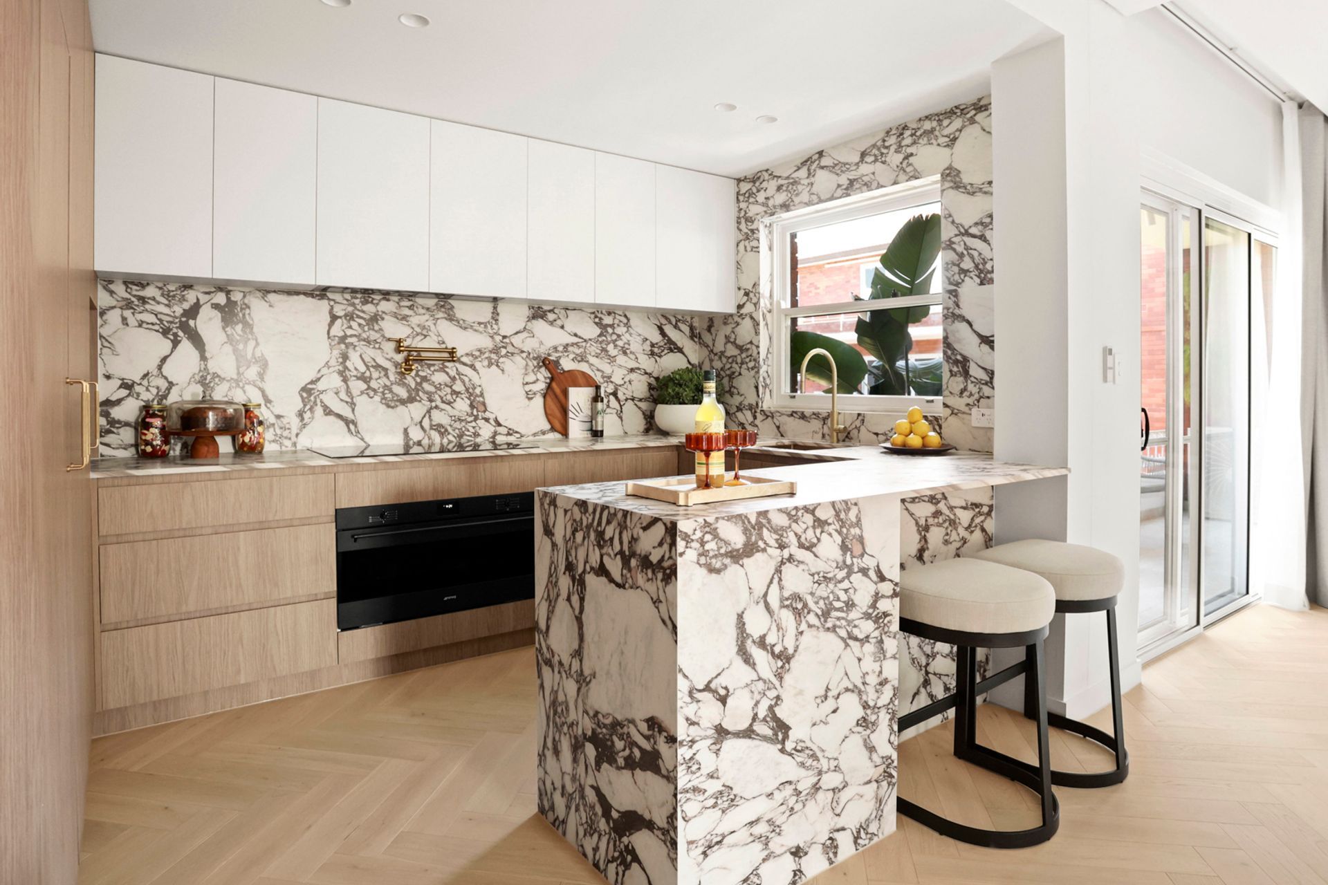 Now open-plan, the kitchen and living area has direct access to the balcony.