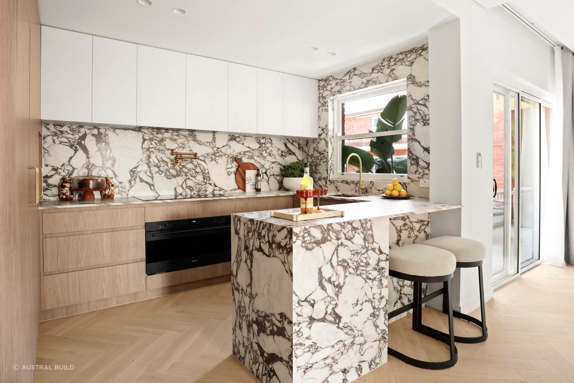 Now open-plan, the kitchen and living area has direct access to the balcony.