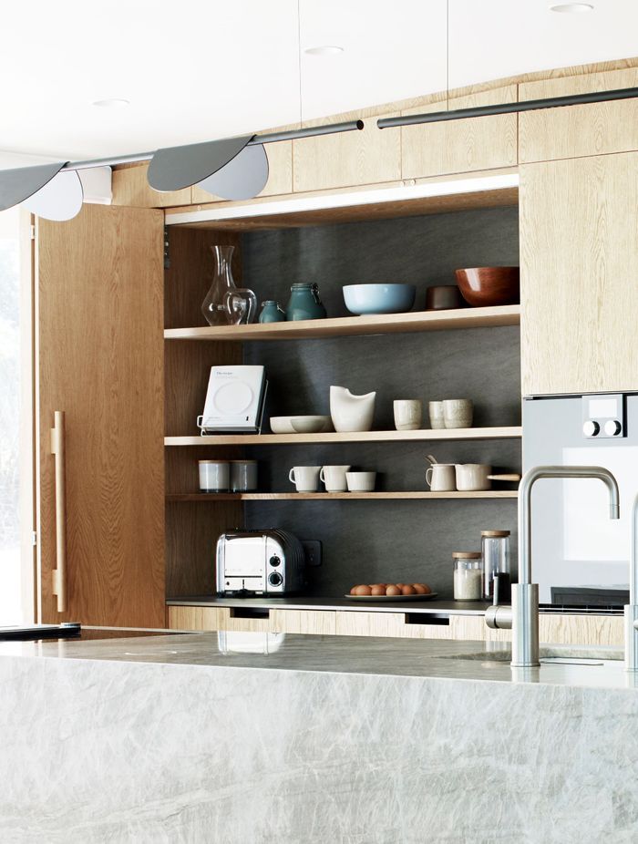 A kitchen is never going to look perfect says Natalie, who designed this extra work space to be hidden away. The tap is by Zenith.