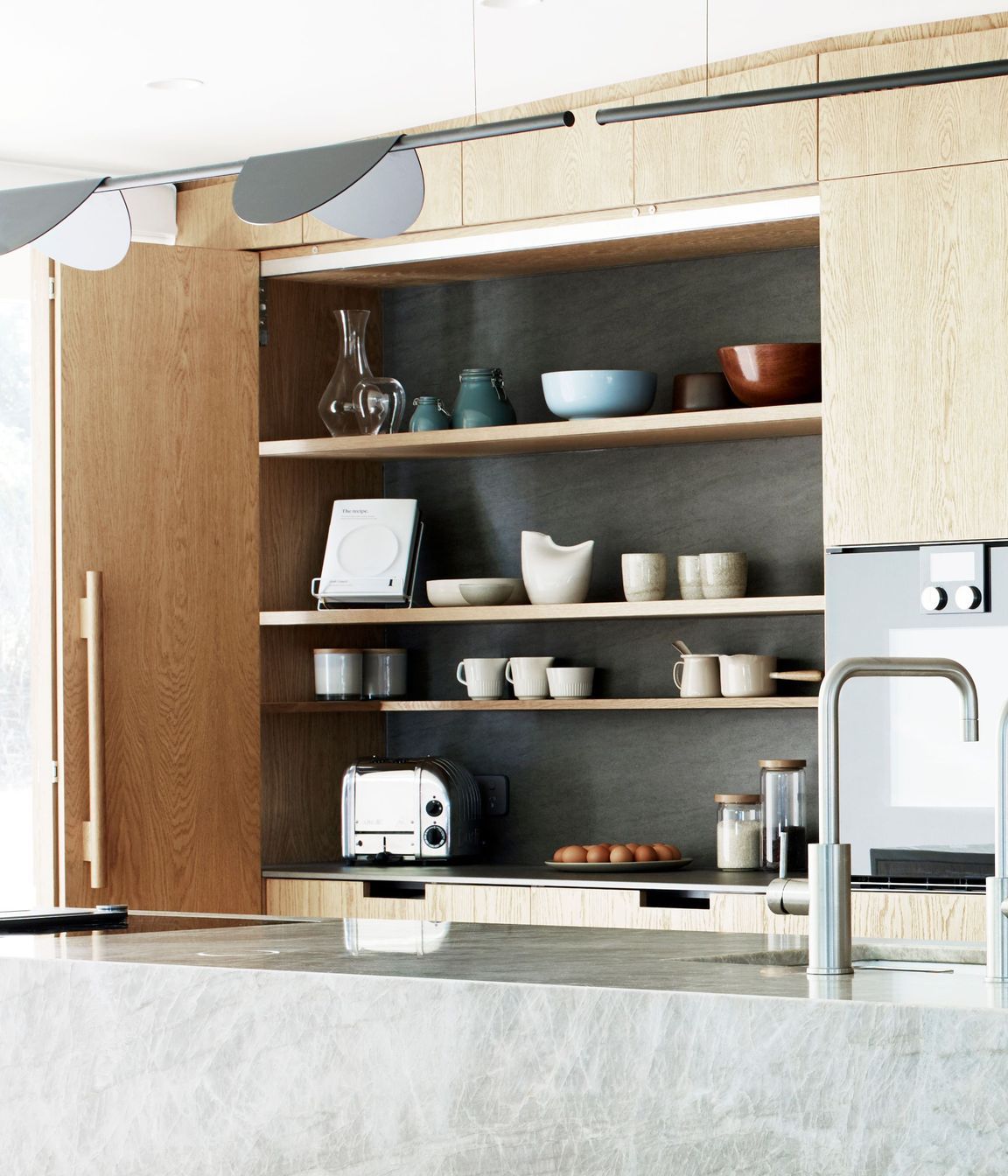 A kitchen is never going to look perfect says Natalie, who designed this extra work space to be hidden away. The tap is by Zenith.