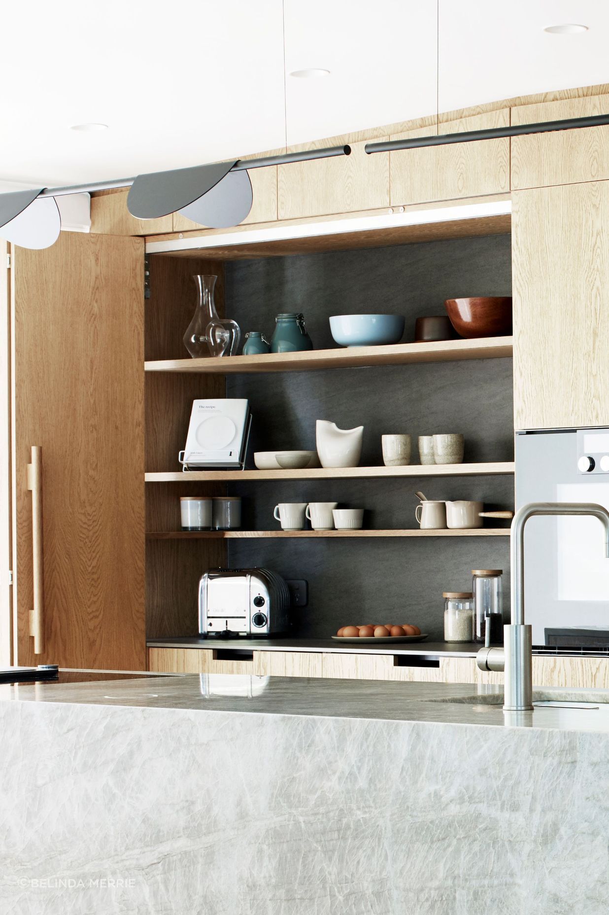 A kitchen is never going to look perfect says Natalie, who designed this extra work space to be hidden away. The tap is by Zenith.