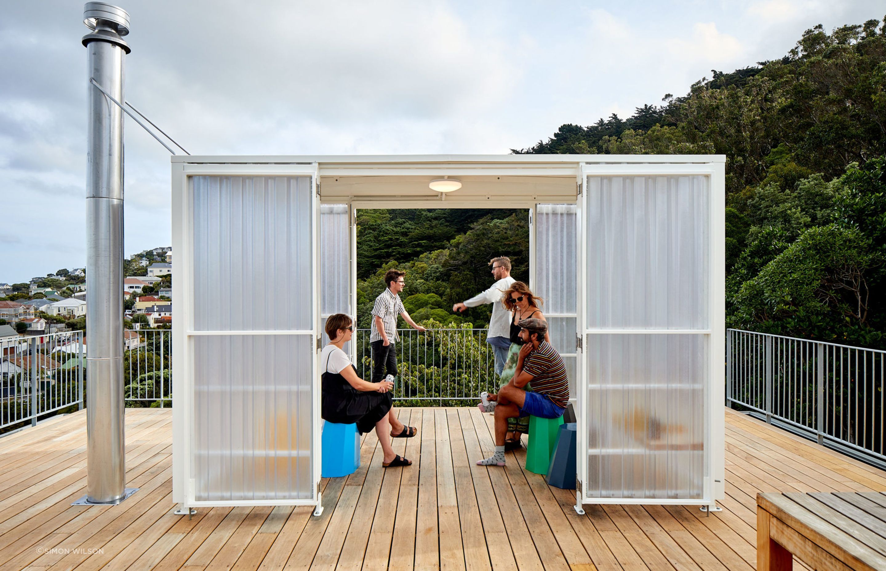 The fun and useful bus-stop-like shelter on the roof deck. Homeowner and builder Adam Pierson and wife Alicia hosted a few parties there. “Probably not as many as we would have liked. But when we did it was good,” he says.