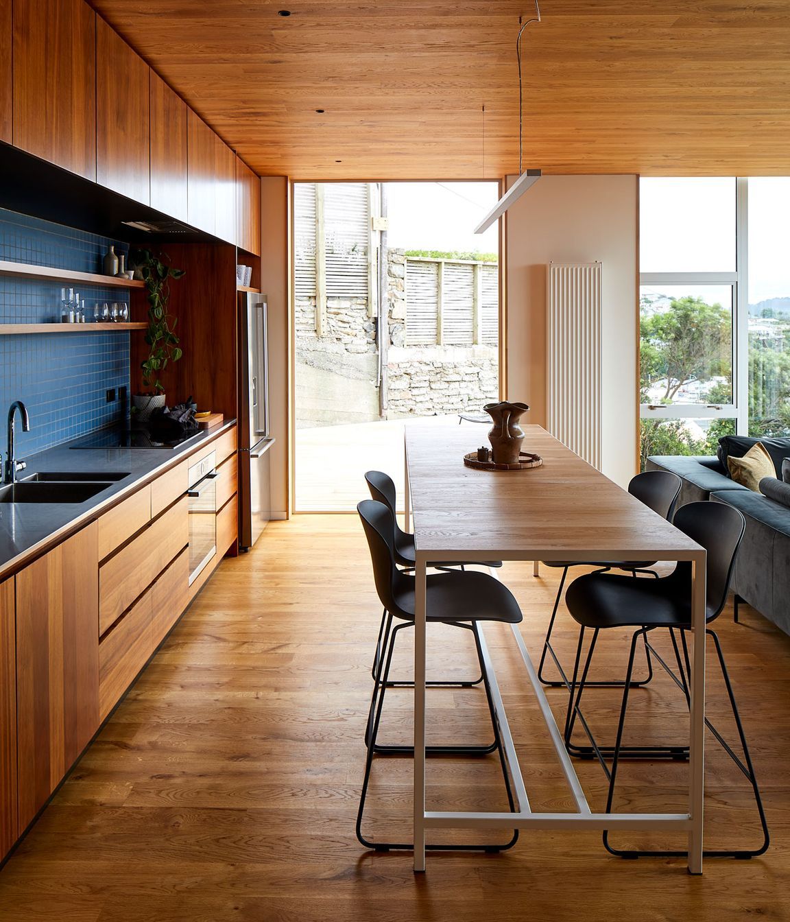 Patchwork Architecture designed the kitchen. The floors and ceilings are VidaSpace oak flooring.