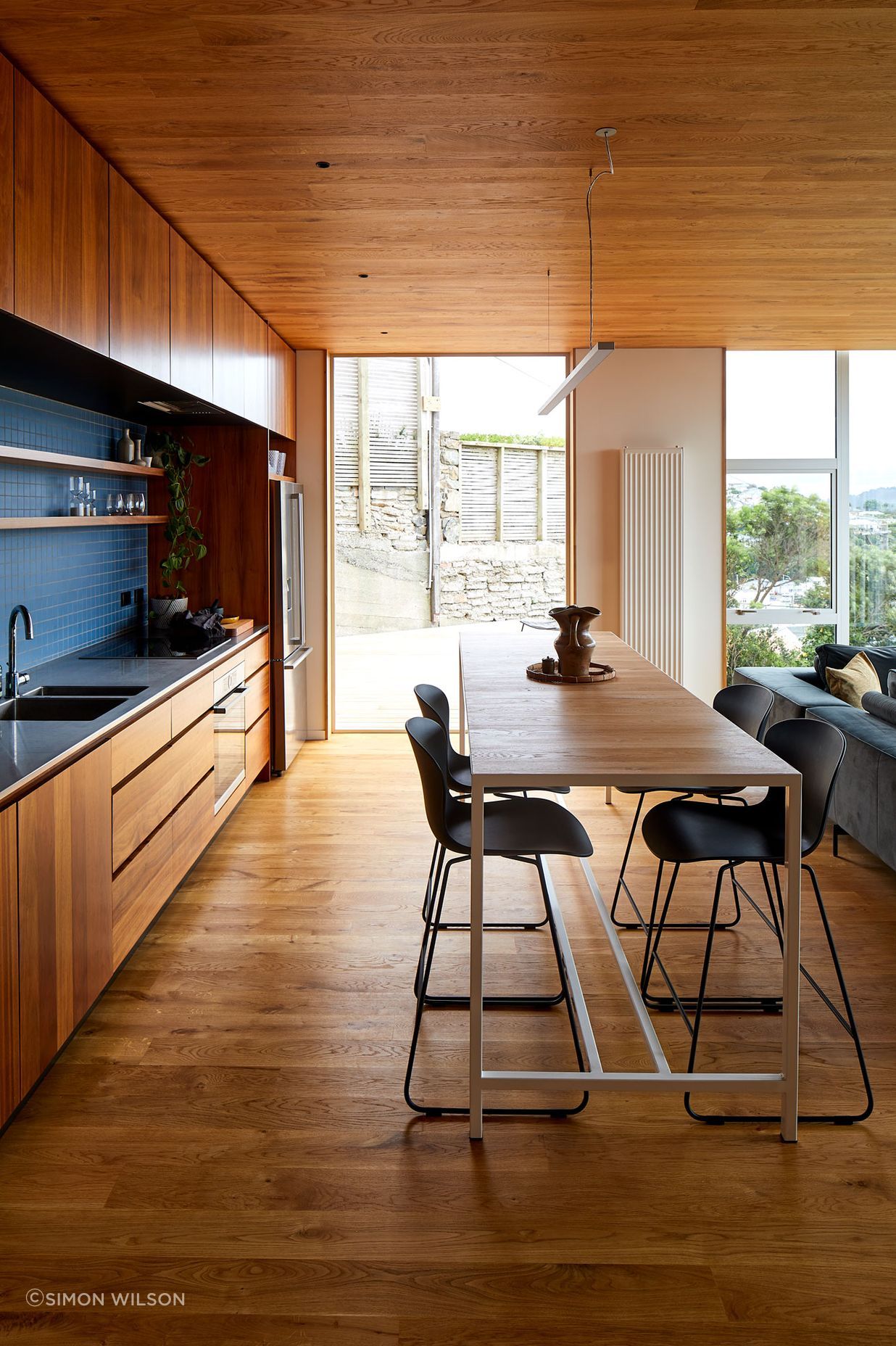 Patchwork Architecture designed the kitchen. The floors and ceilings are VidaSpace oak flooring.