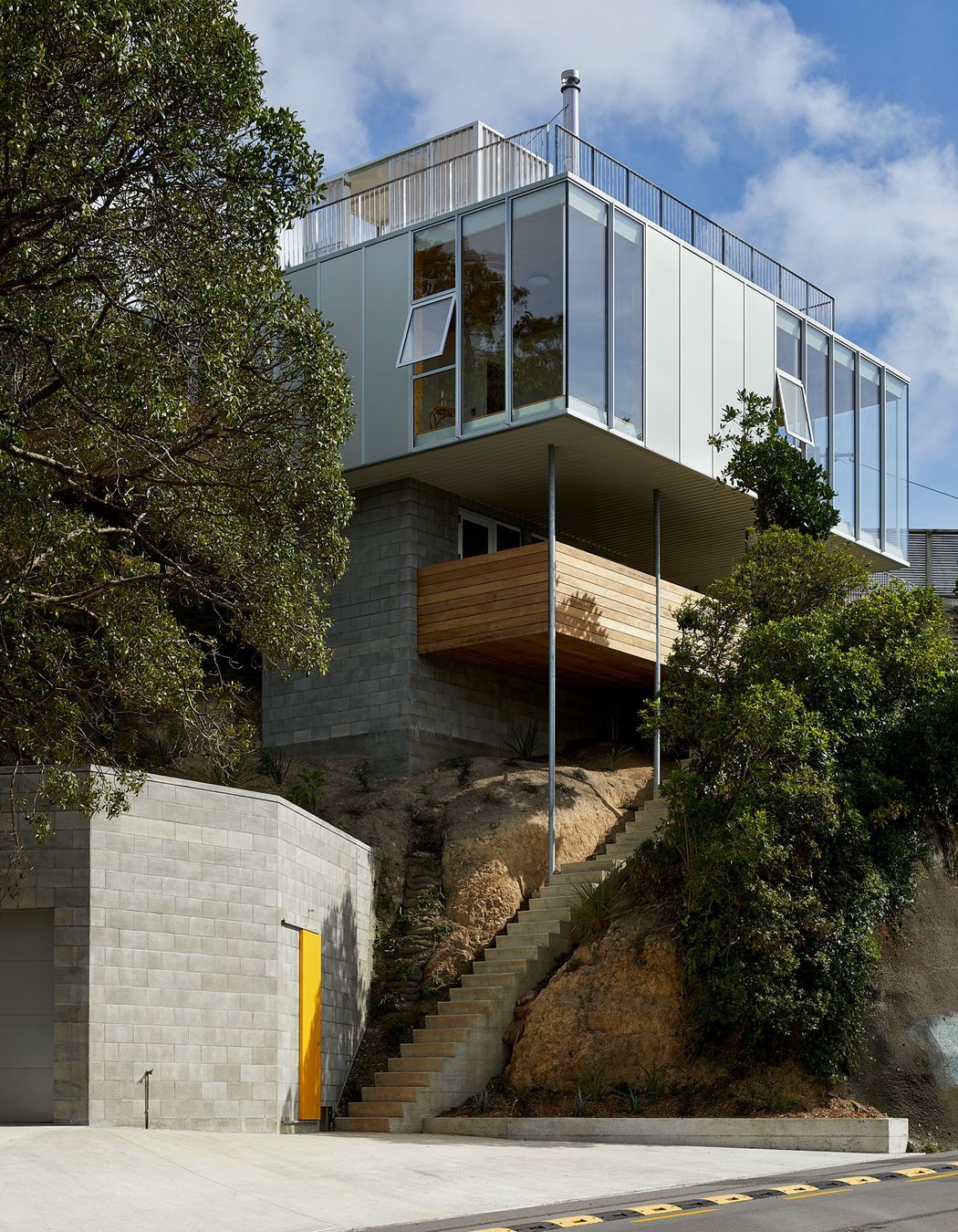 The family home designed by Patchwork Architecture. It was a tricky site, but rocky, which provided a good foundation. “So it's almost totally out of the ground. It's barely dug into the hillside at all,” says Patchwork Architecture's Ben Mitchell-Anyon.