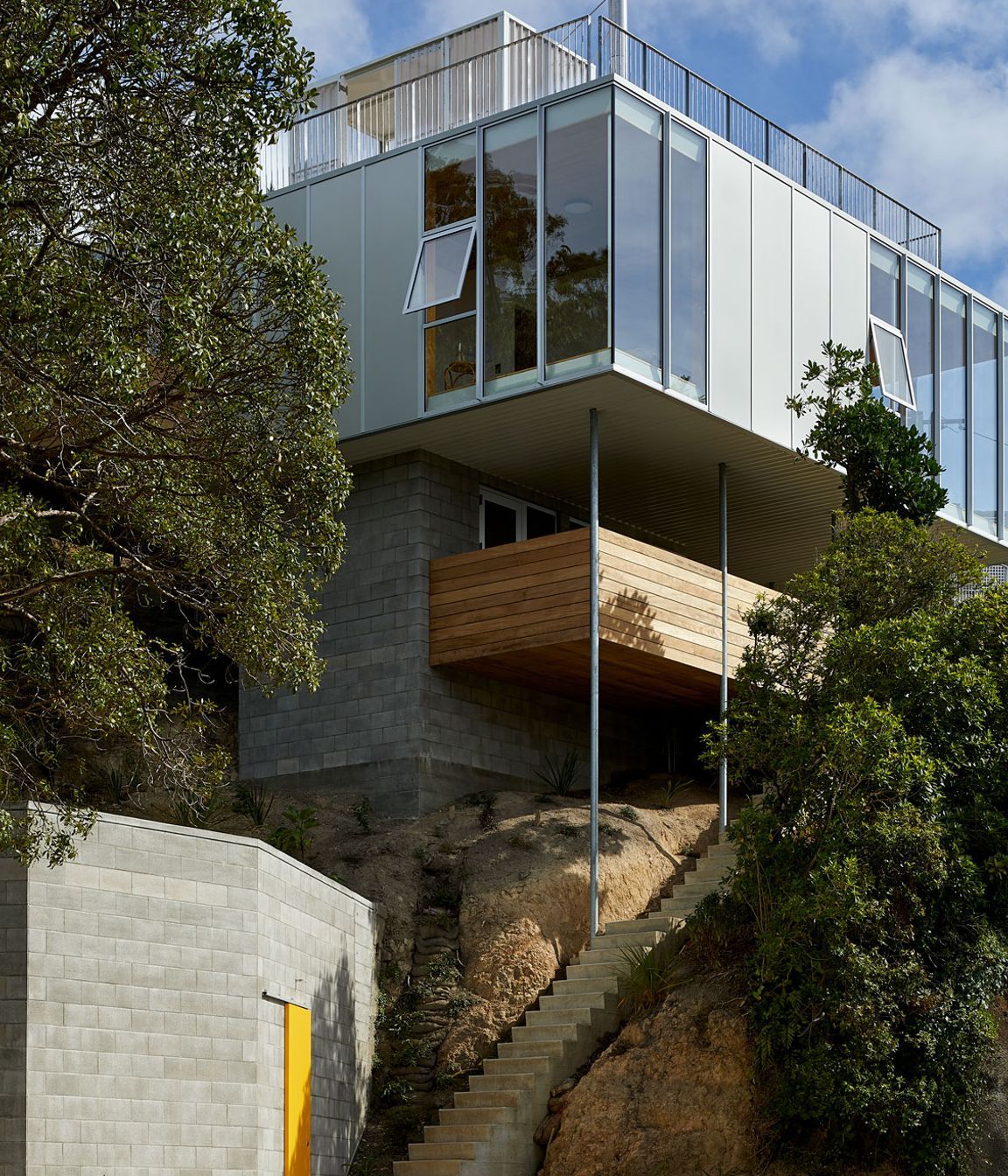 The family home designed by Patchwork Architecture. It was a tricky site, but rocky, which provided a good foundation. “So it's almost totally out of the ground. It's barely dug into the hillside at all,” says Patchwork Architecture's Ben Mitchell-Anyon.