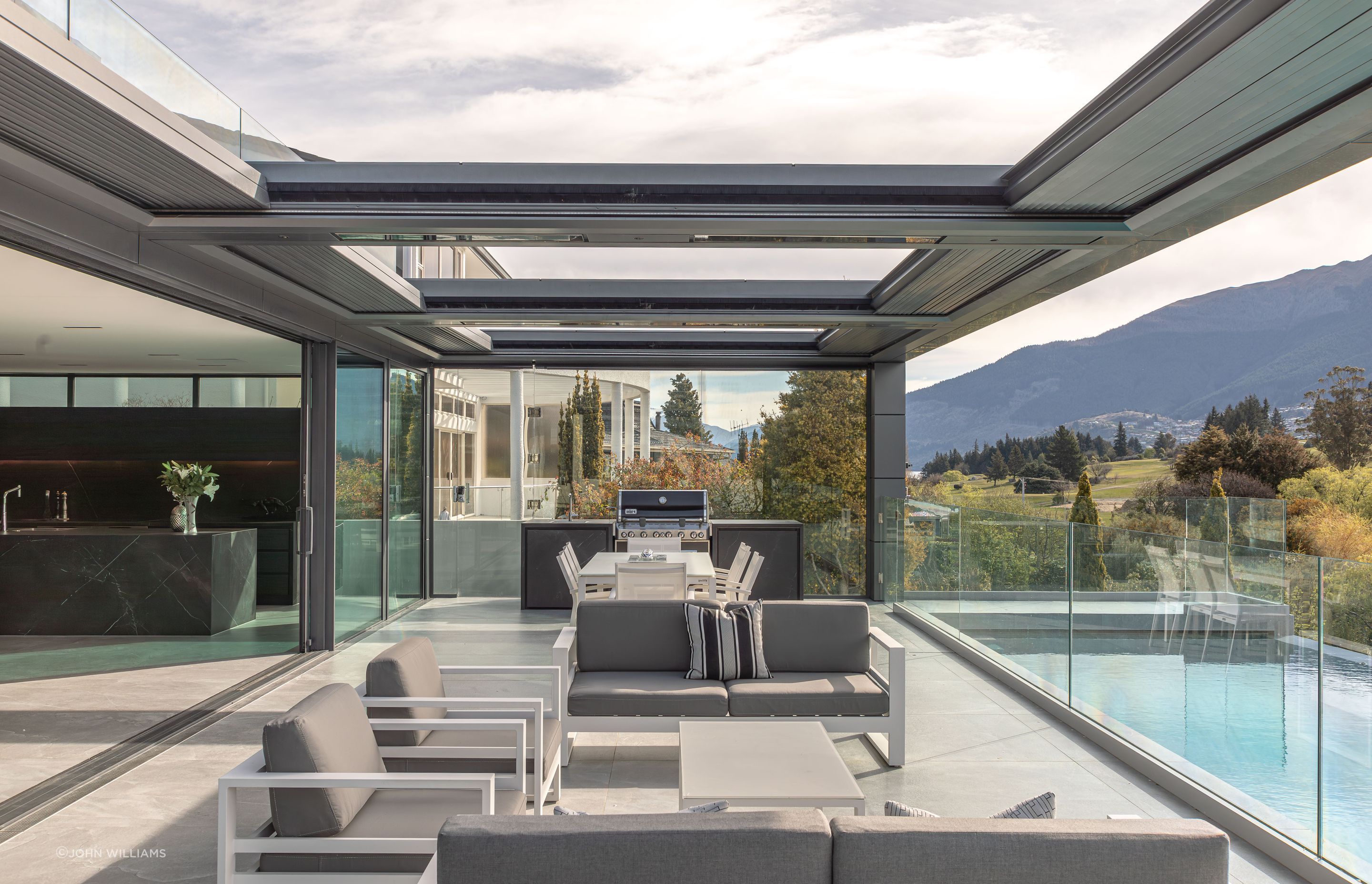 The living level flows freely onto an exterior pool terrace.