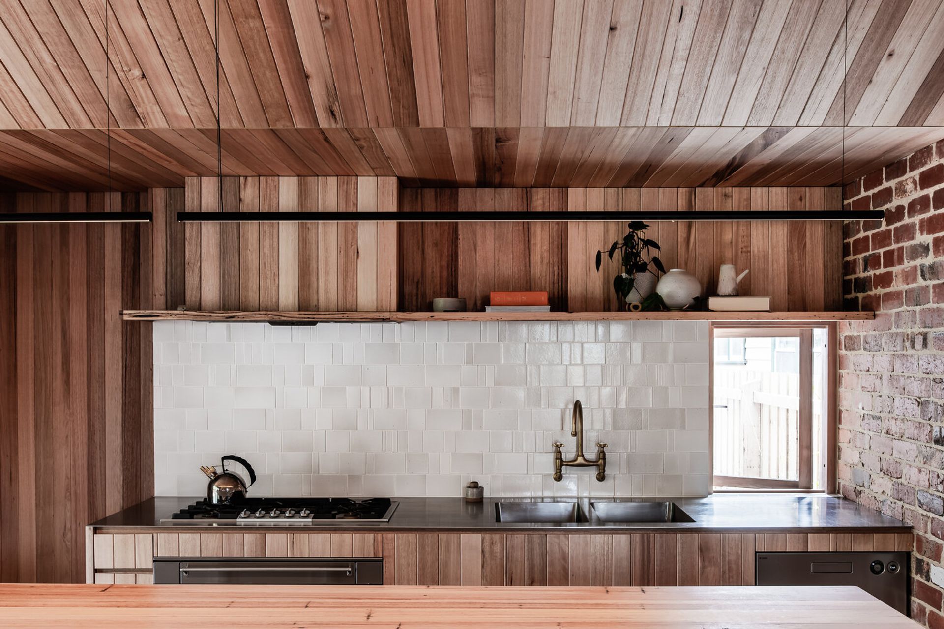 Textural warmth through wood, brick and tile in the Northcote Residence Kitchen - Photography: Tom Blachford