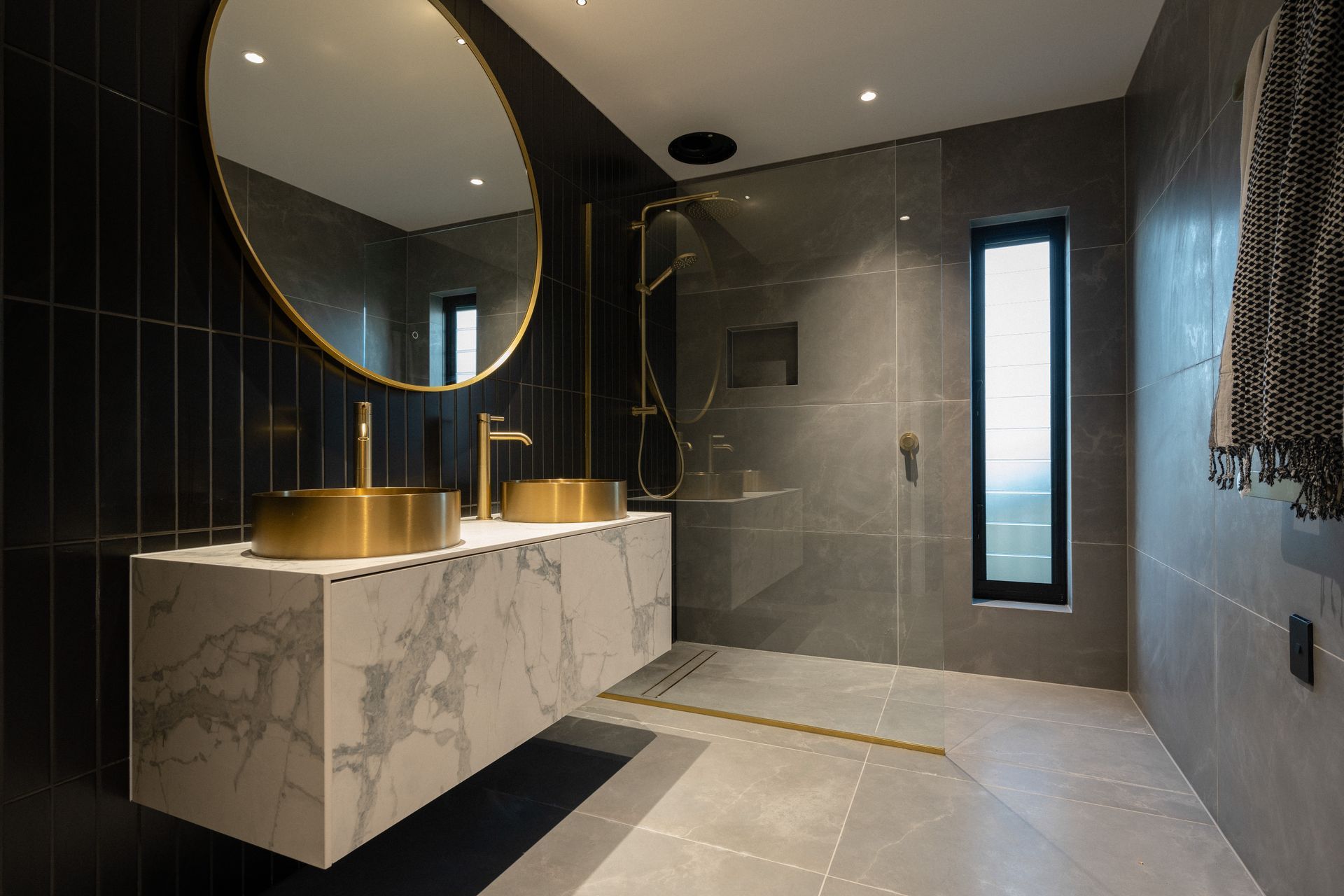 The brass basins and tapware from Elite Bathroomware add wow factor.