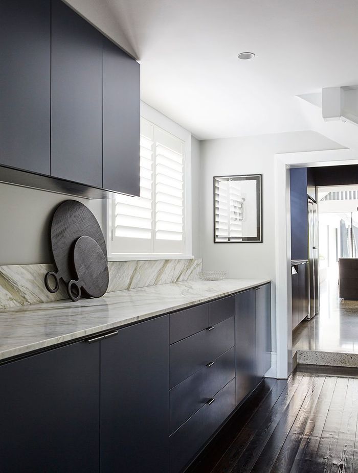 The Butler's laundry uses the same materiality as the kitchen.