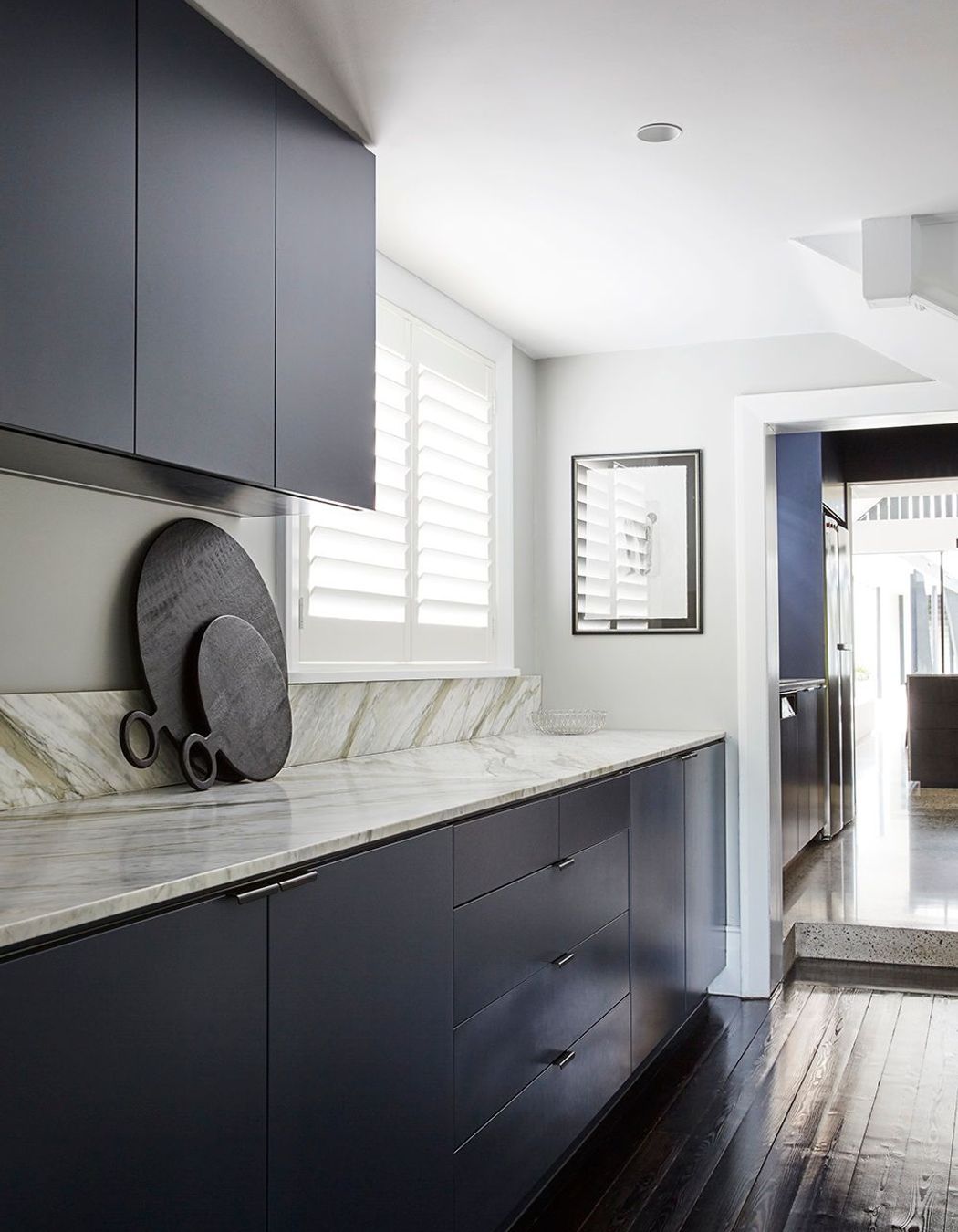 The Butler's laundry uses the same materiality as the kitchen.