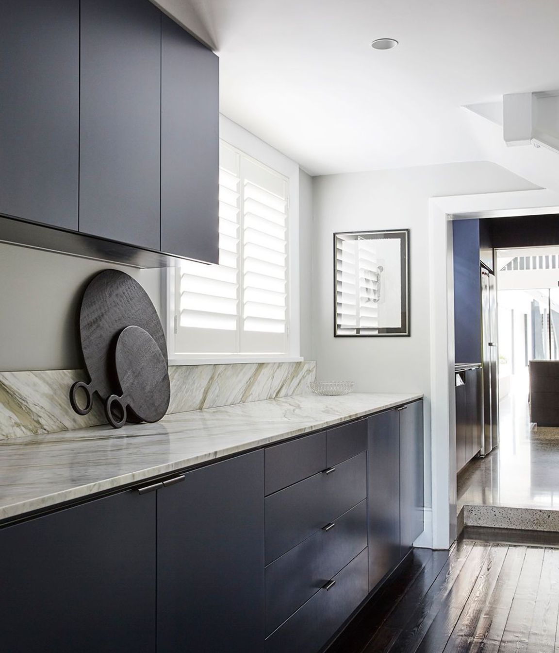 The Butler's laundry uses the same materiality as the kitchen.