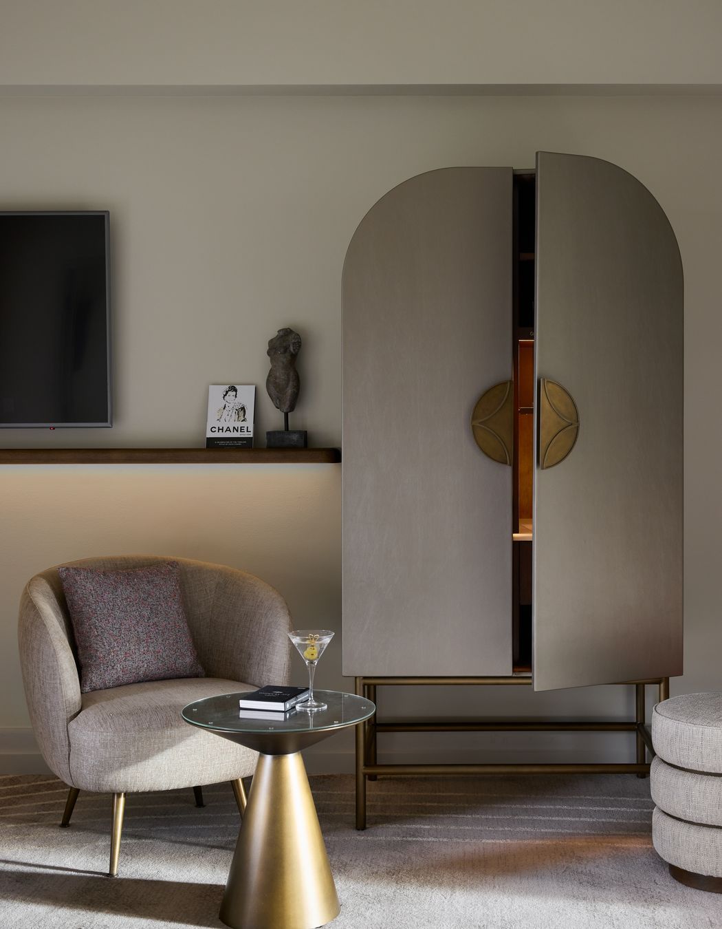 Custom Art Nouveau cabinetry conceals the minibar.