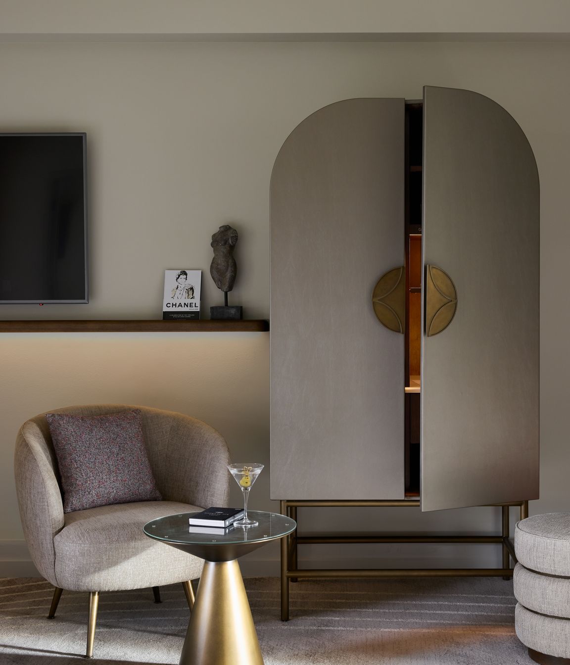 Custom Art Nouveau cabinetry conceals the minibar.