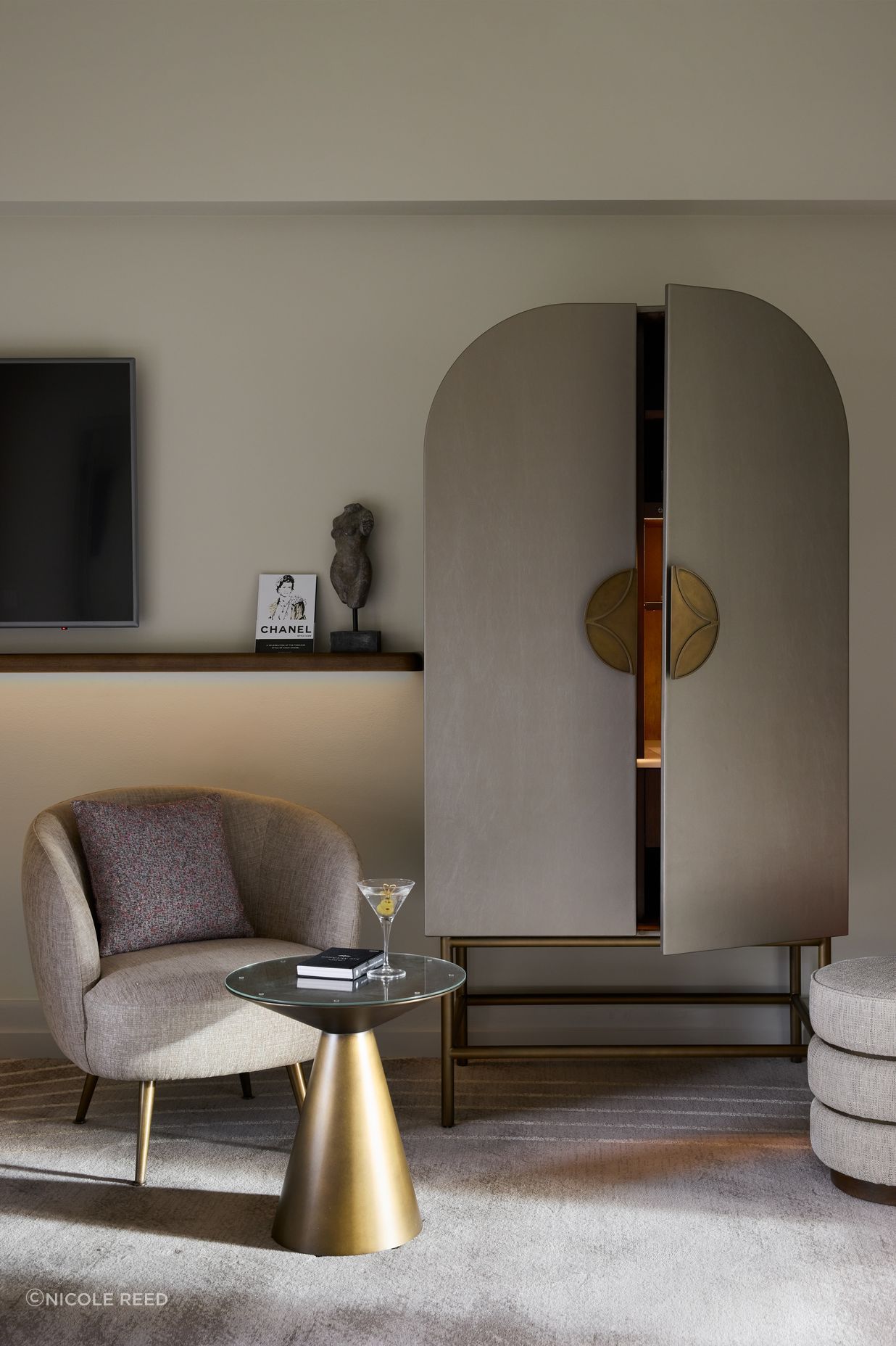 Custom Art Nouveau cabinetry conceals the minibar.