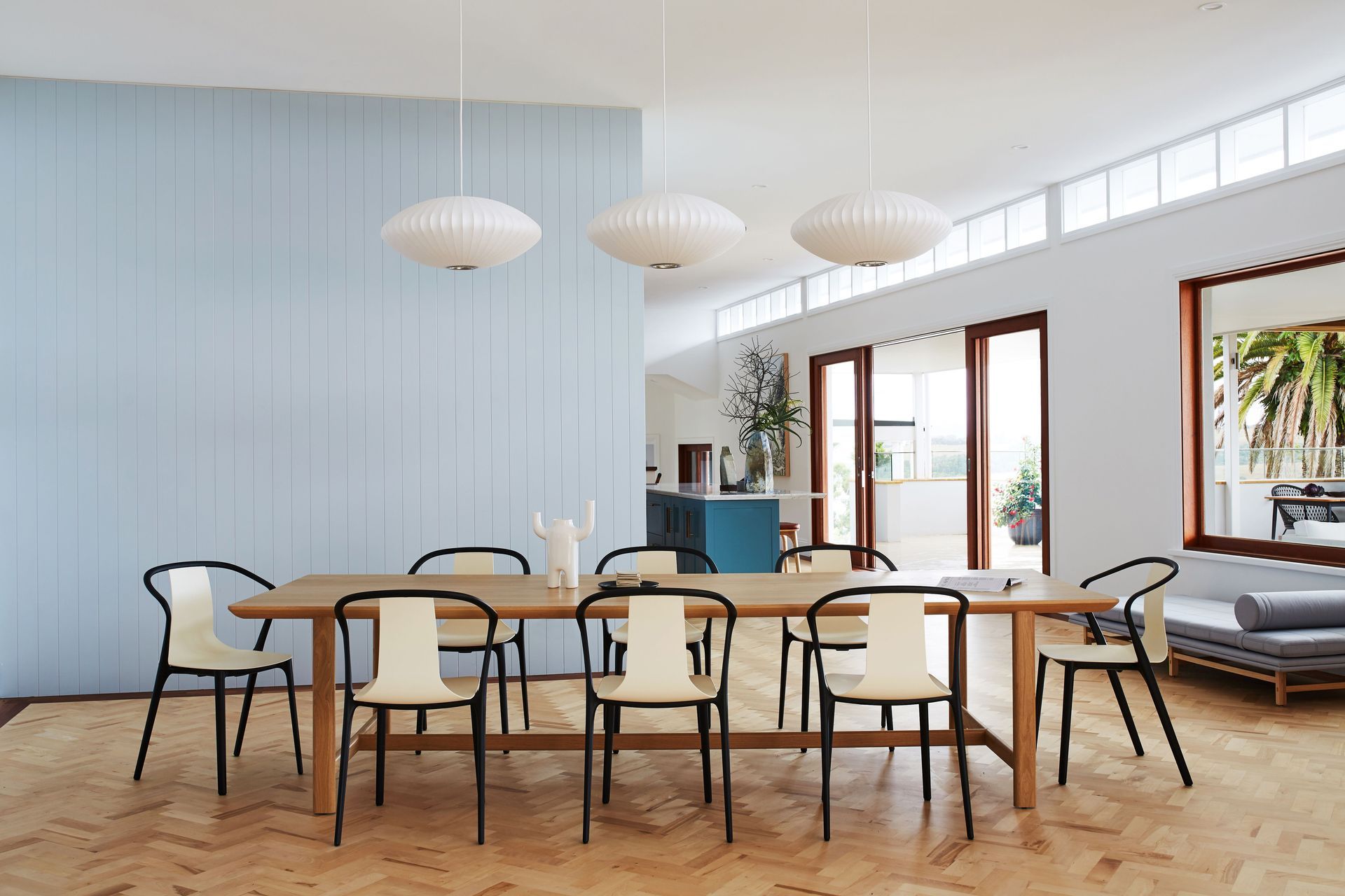 Three simple pendants highlight the dining table.