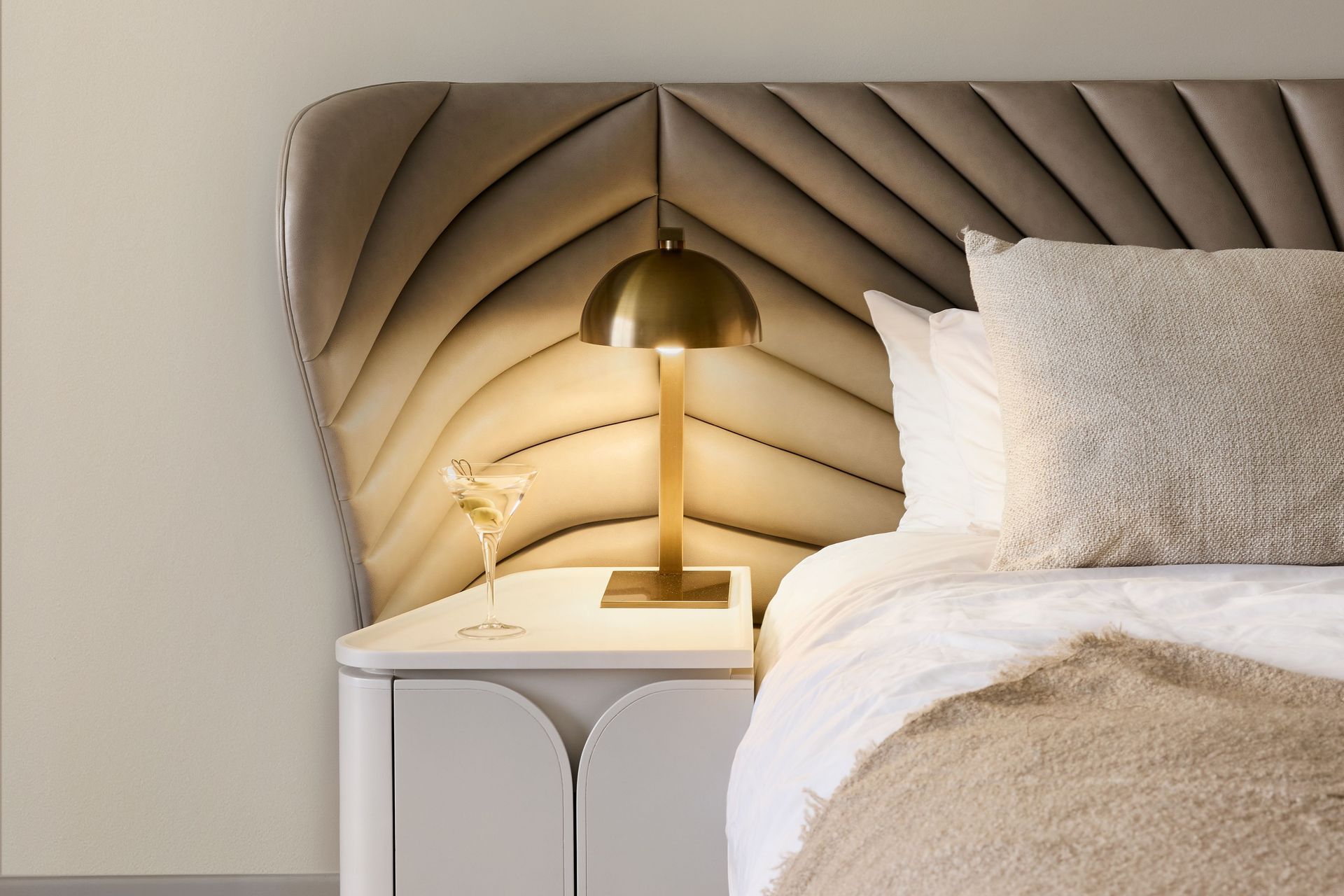 The custom bedheads feature an Art Nouveau pattern that has been quilted on contemporary fabric.