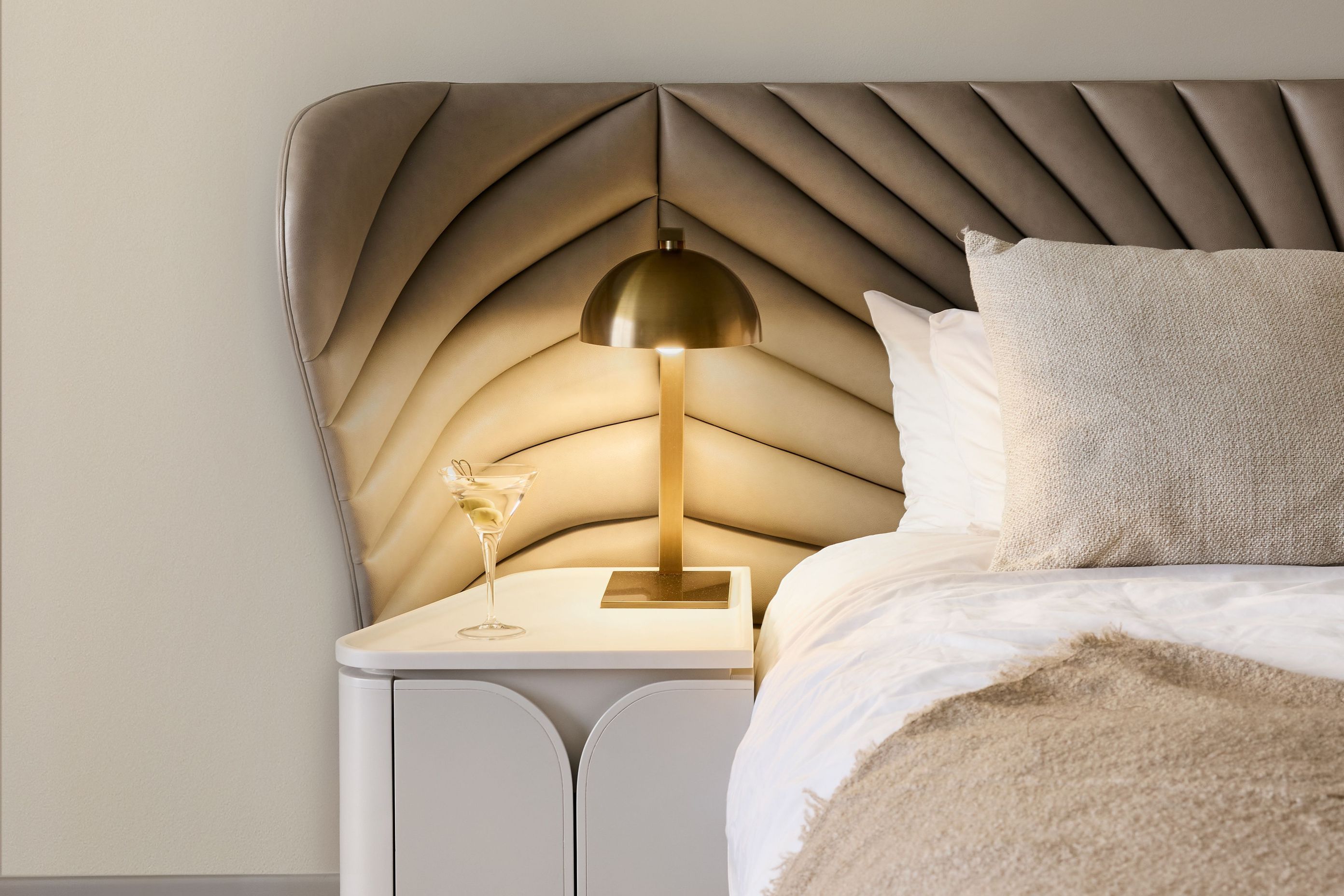 The custom bedheads feature an Art Nouveau pattern that has been quilted on contemporary fabric.