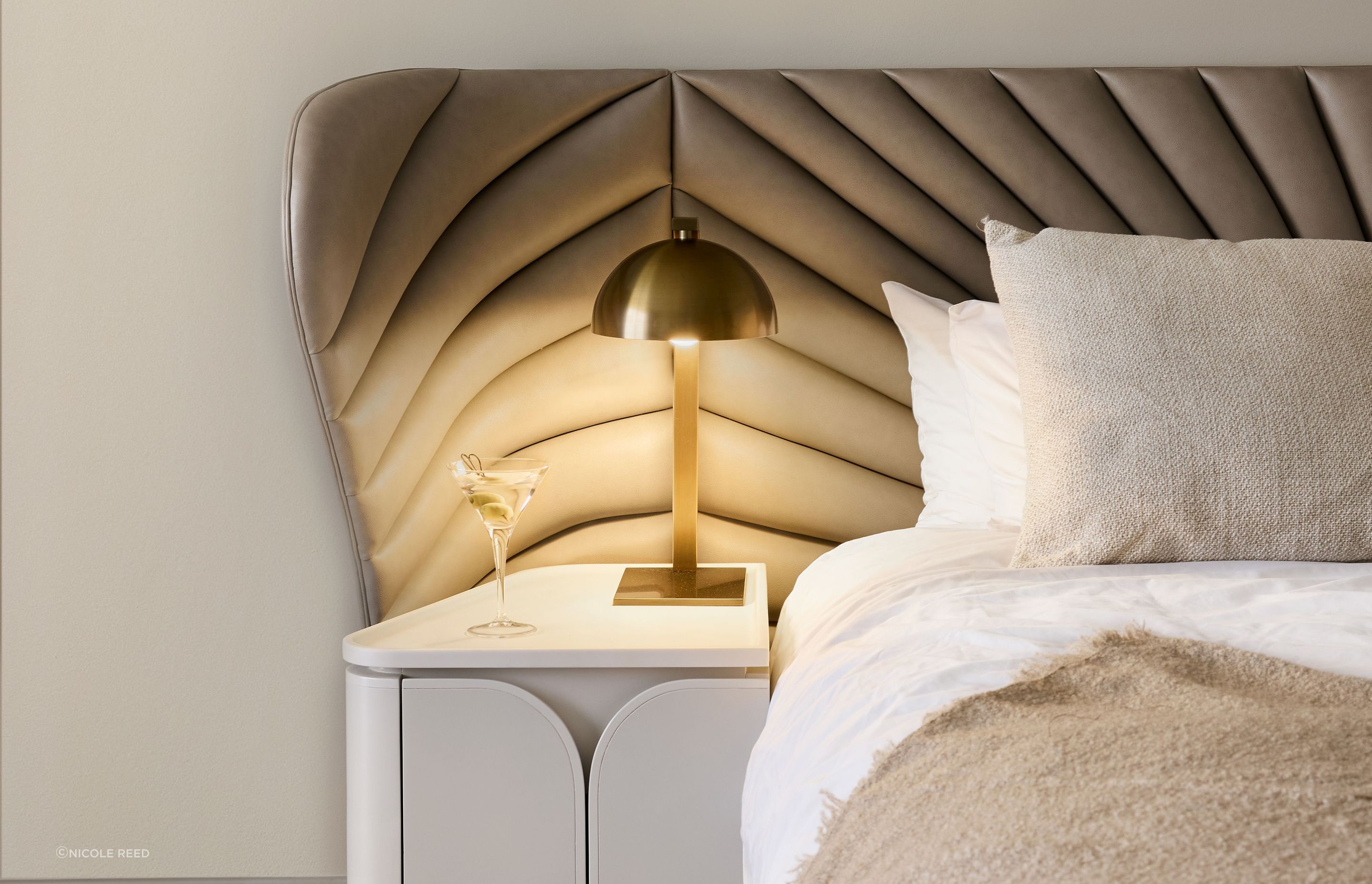 The custom bedheads feature an Art Nouveau pattern that has been quilted on contemporary fabric.