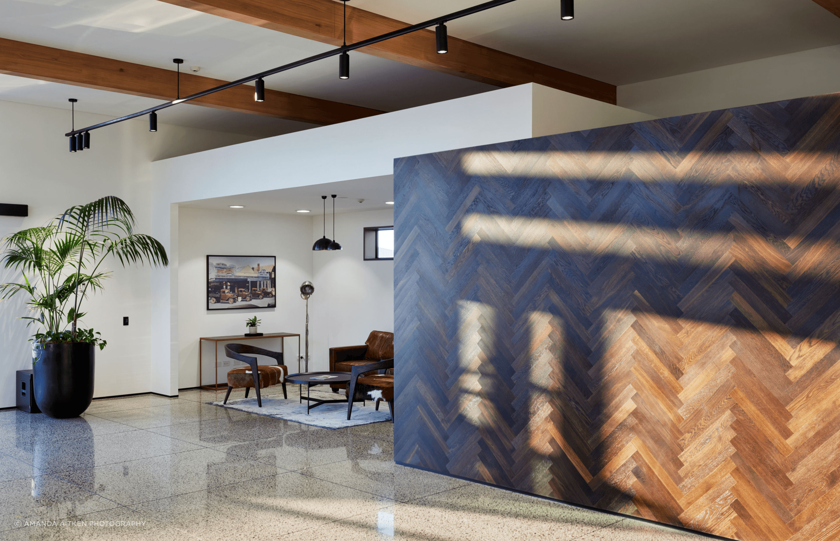 Rich timber elements and black light fittings complete the look.