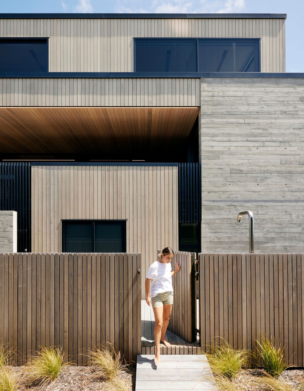 For all the architectural precision, it’s a fun and comfortable home for a young family. “It functions really well,” says Brendon. There are multiple decks, outdoor showers and a laundry window especially for throwing in wet togs and towels.