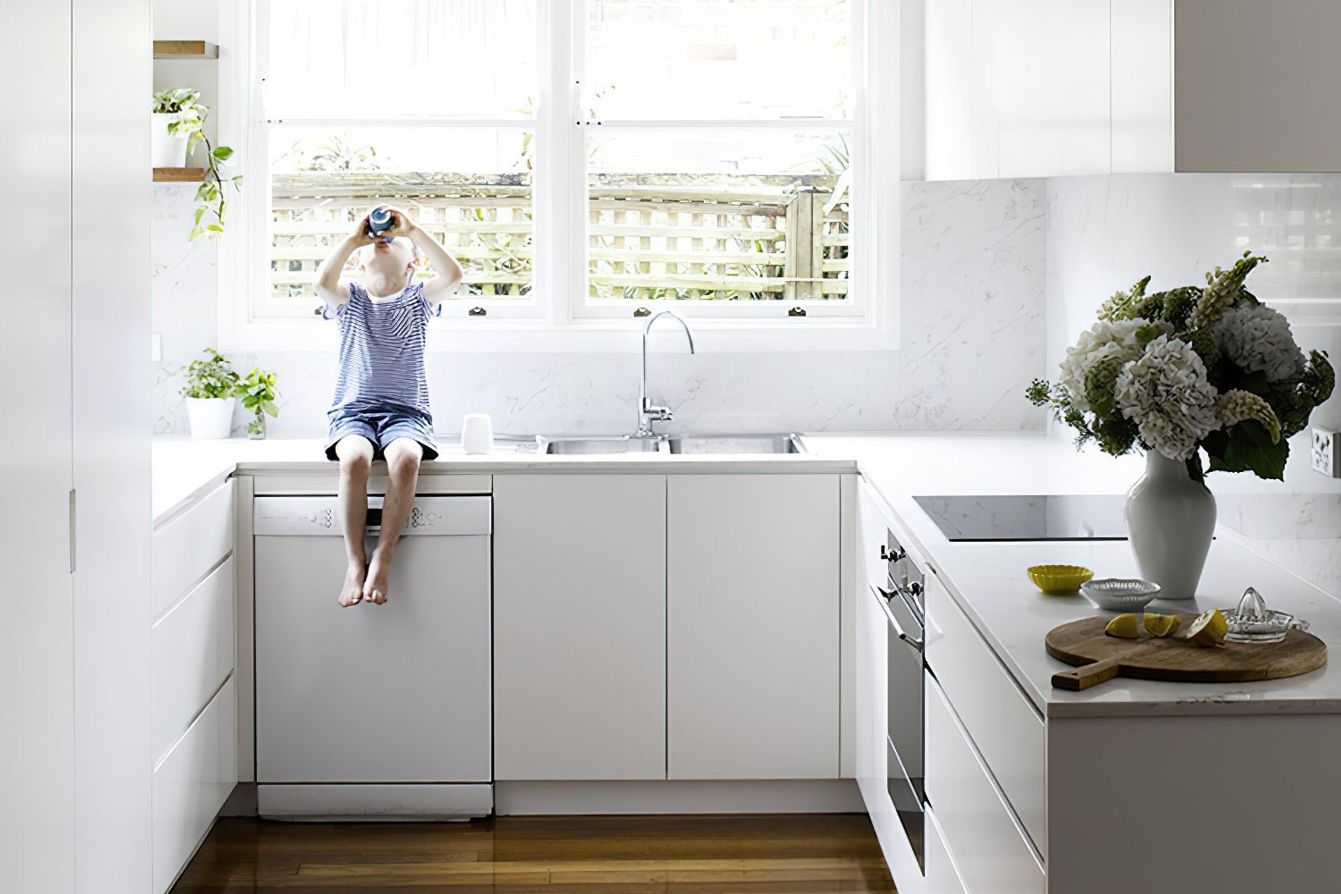 Making use of floor cabinets is key in a cosy kitchen like this one in Neutral Bay