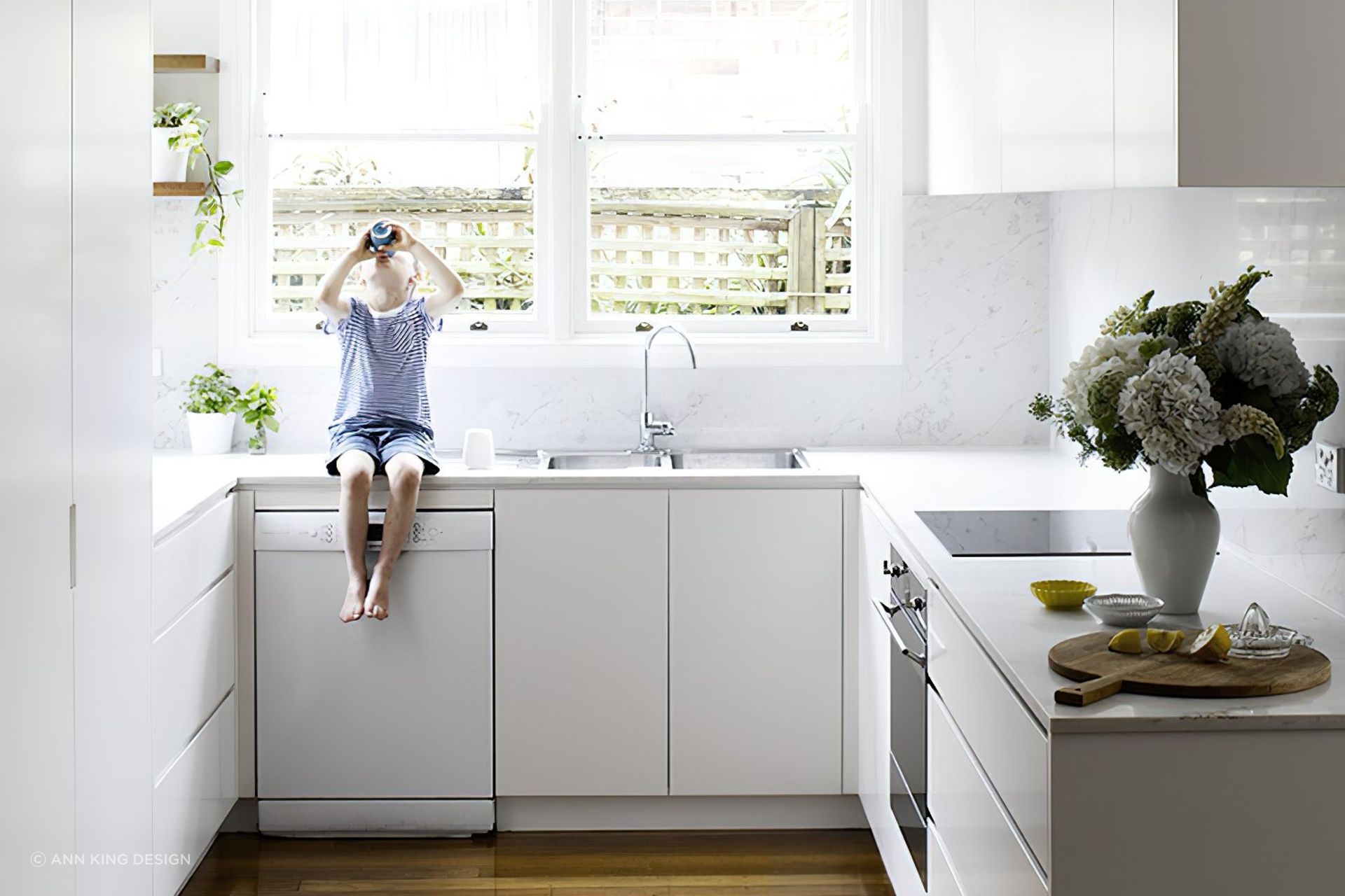 Making use of floor cabinets is key in a cosy kitchen like this one in Neutral Bay